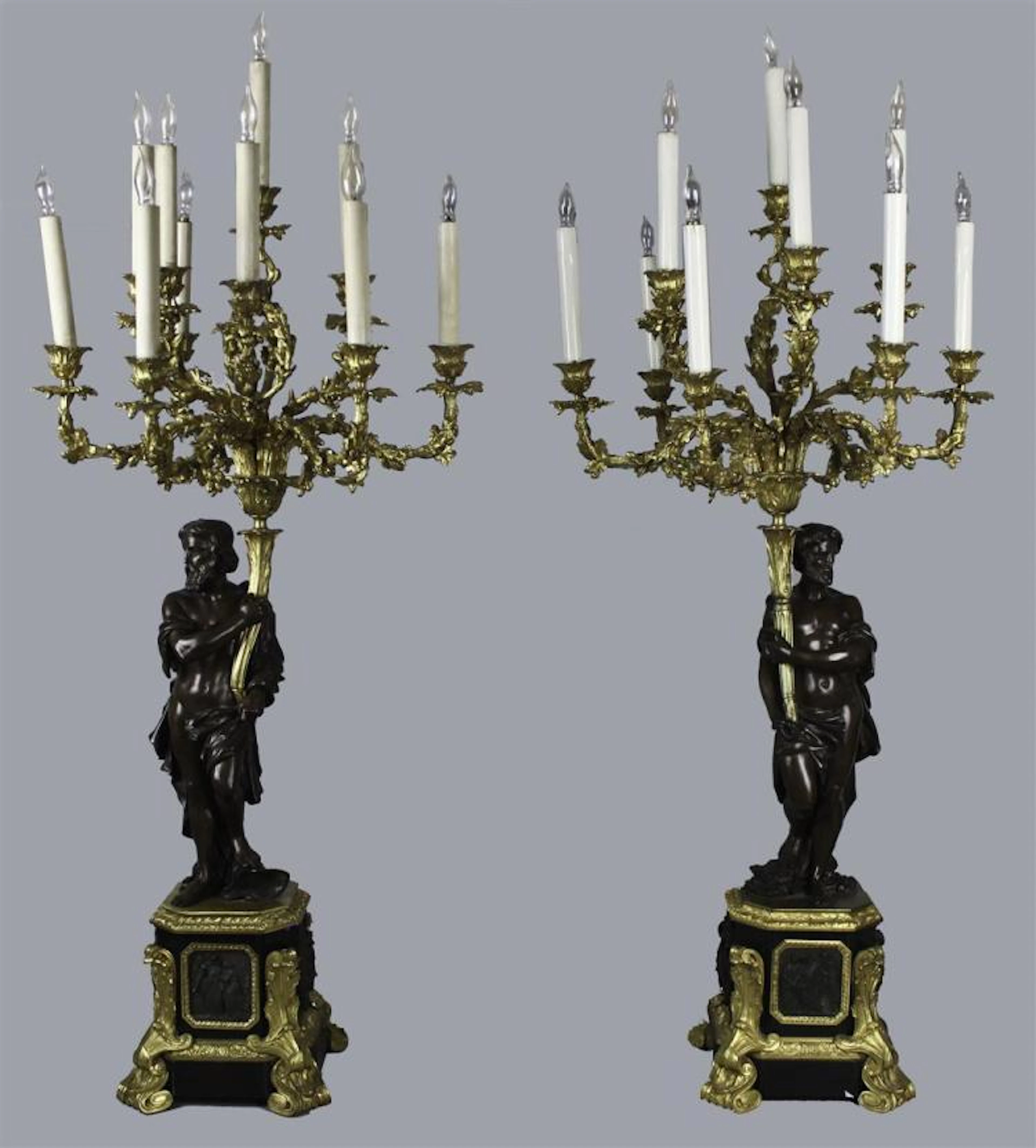 PAIR OF LOUIS XVI STYLE ORMOLU AND BRONZE FIGURAL NINE-LIGHT CANDELABRA
