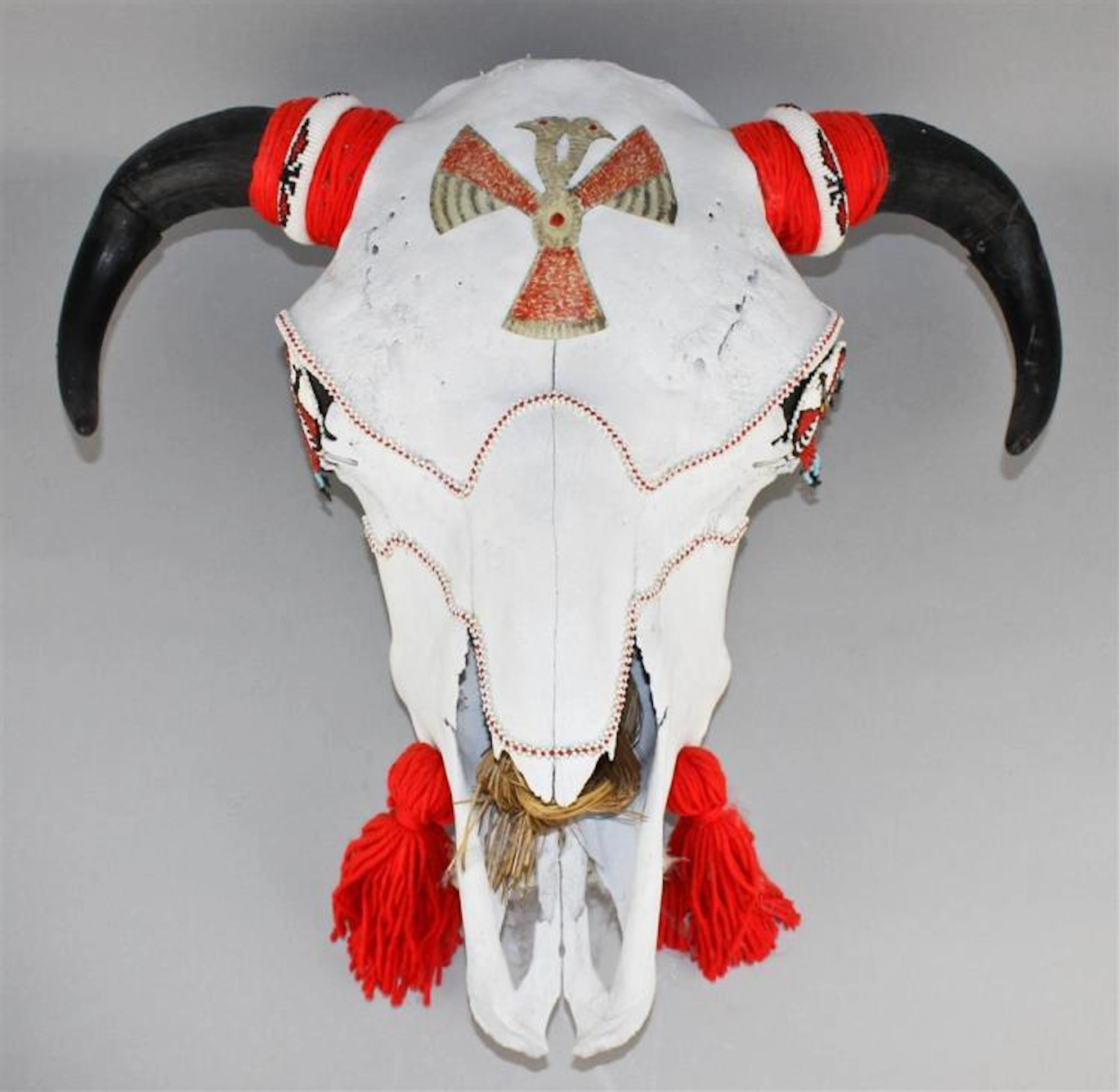 RETHA WALDEN GAMBARO (NATIVE AMERICAN, CREEK, 1917-2013) PAINTED AND EMBELLISHED ANIMAL SKULL