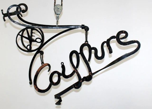 French wrought iron trade sign on bracket