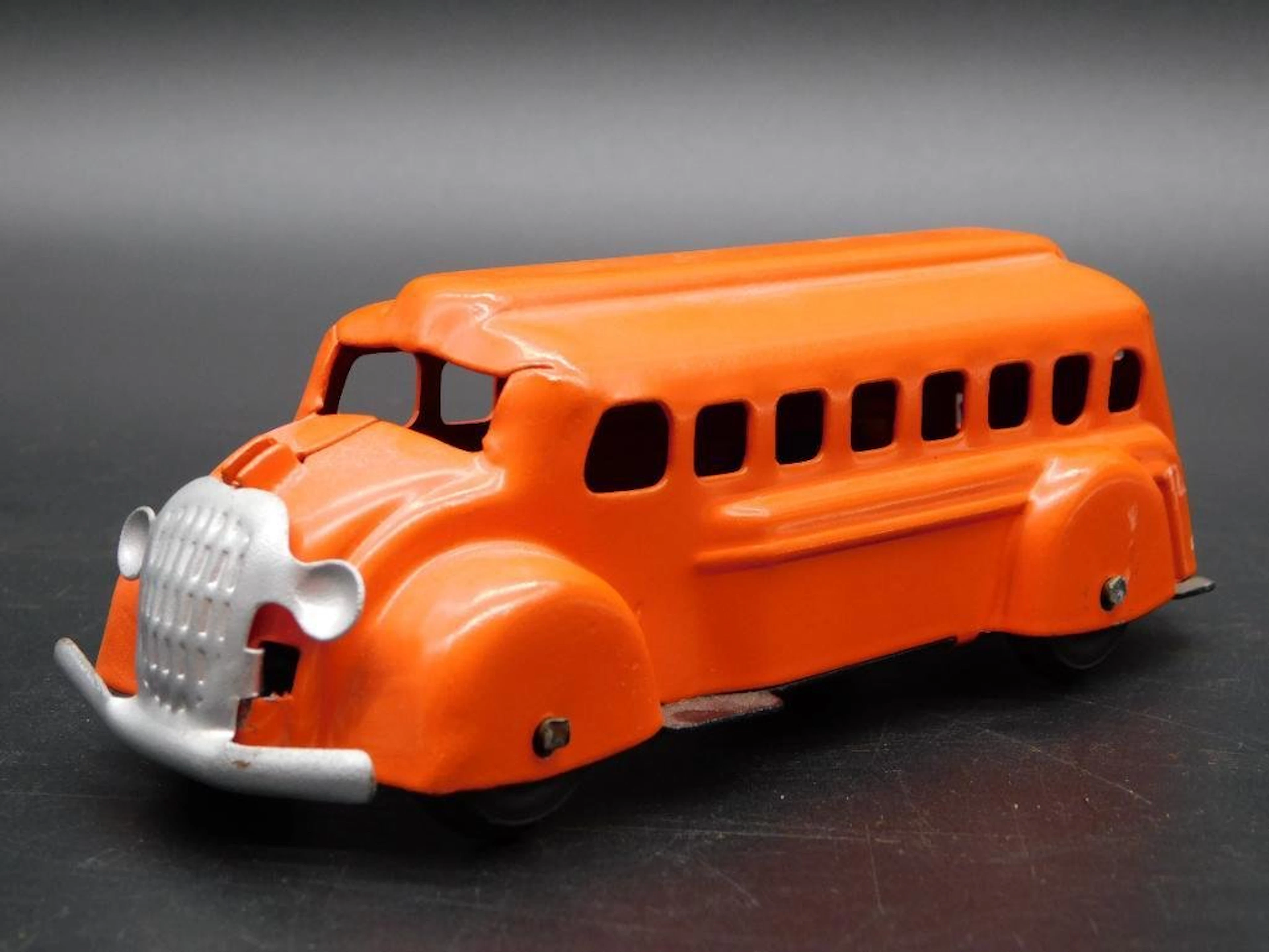 WYANDOTTE ORANGE METAL BUS TIN TOY