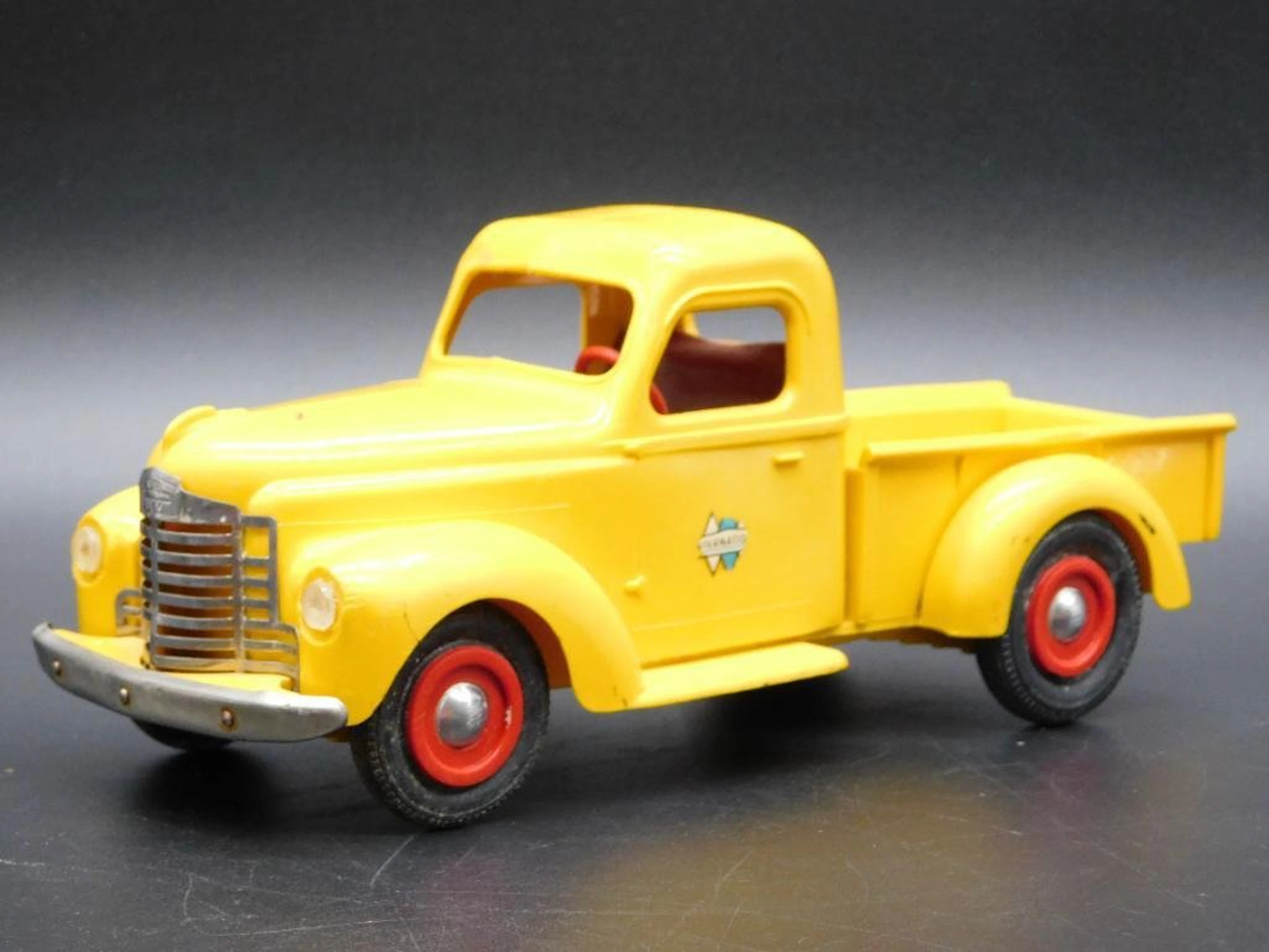 INTERNATIONAL YELLOW TRUCK PLASTIC TOY