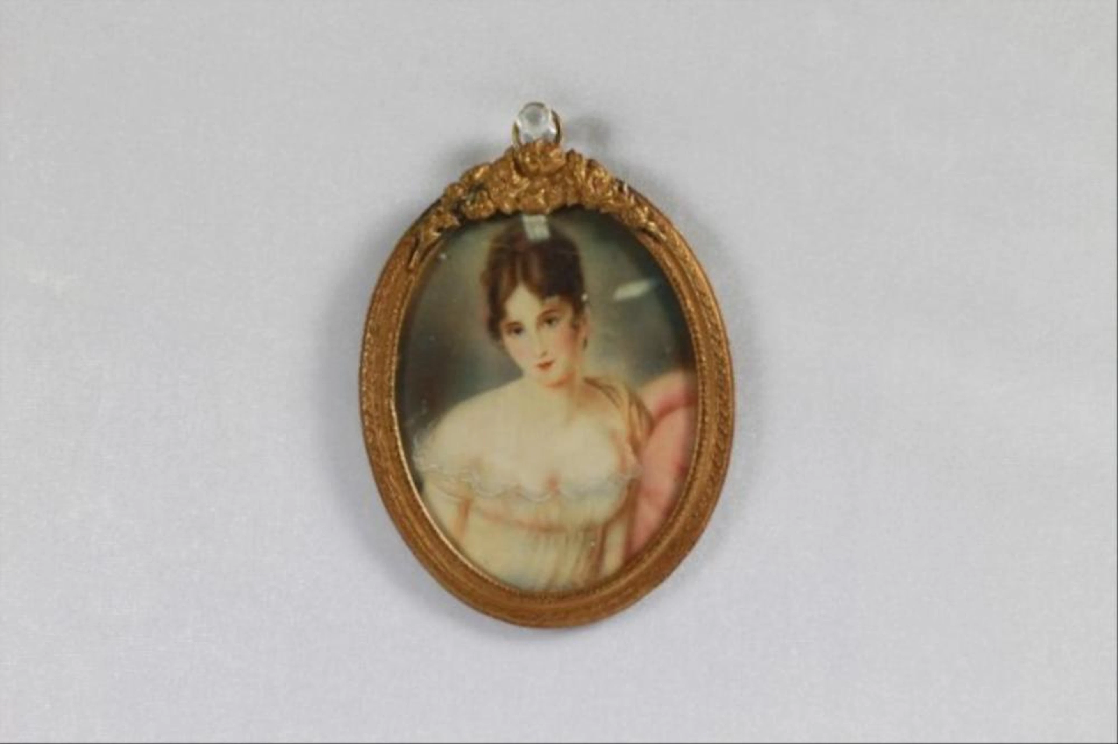 BRONZE FRAME WITH MINIATURE PORTRAIT OF A WOMAN ON