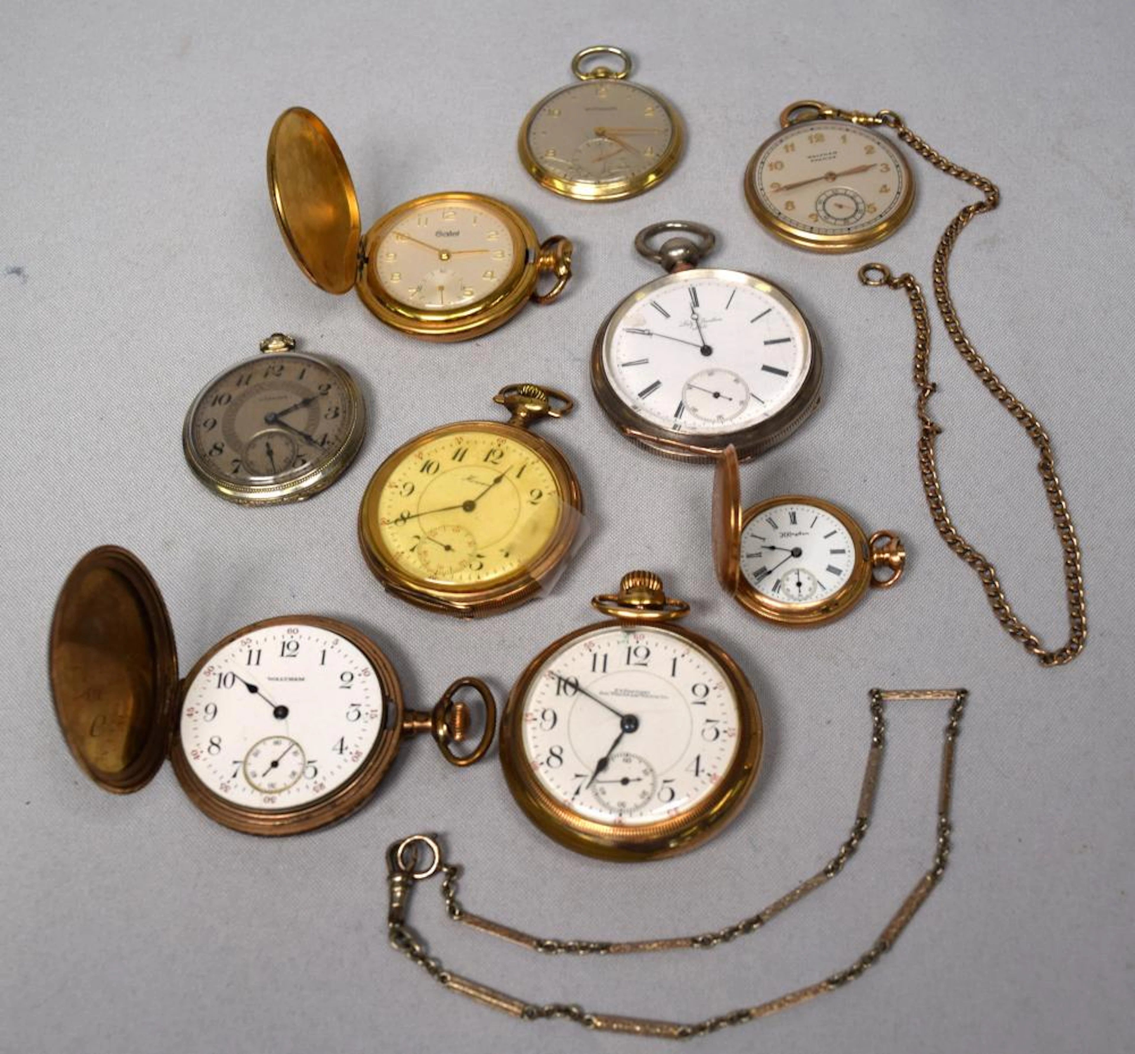 NINE GOLD-PLATED POCKET WATCHES: