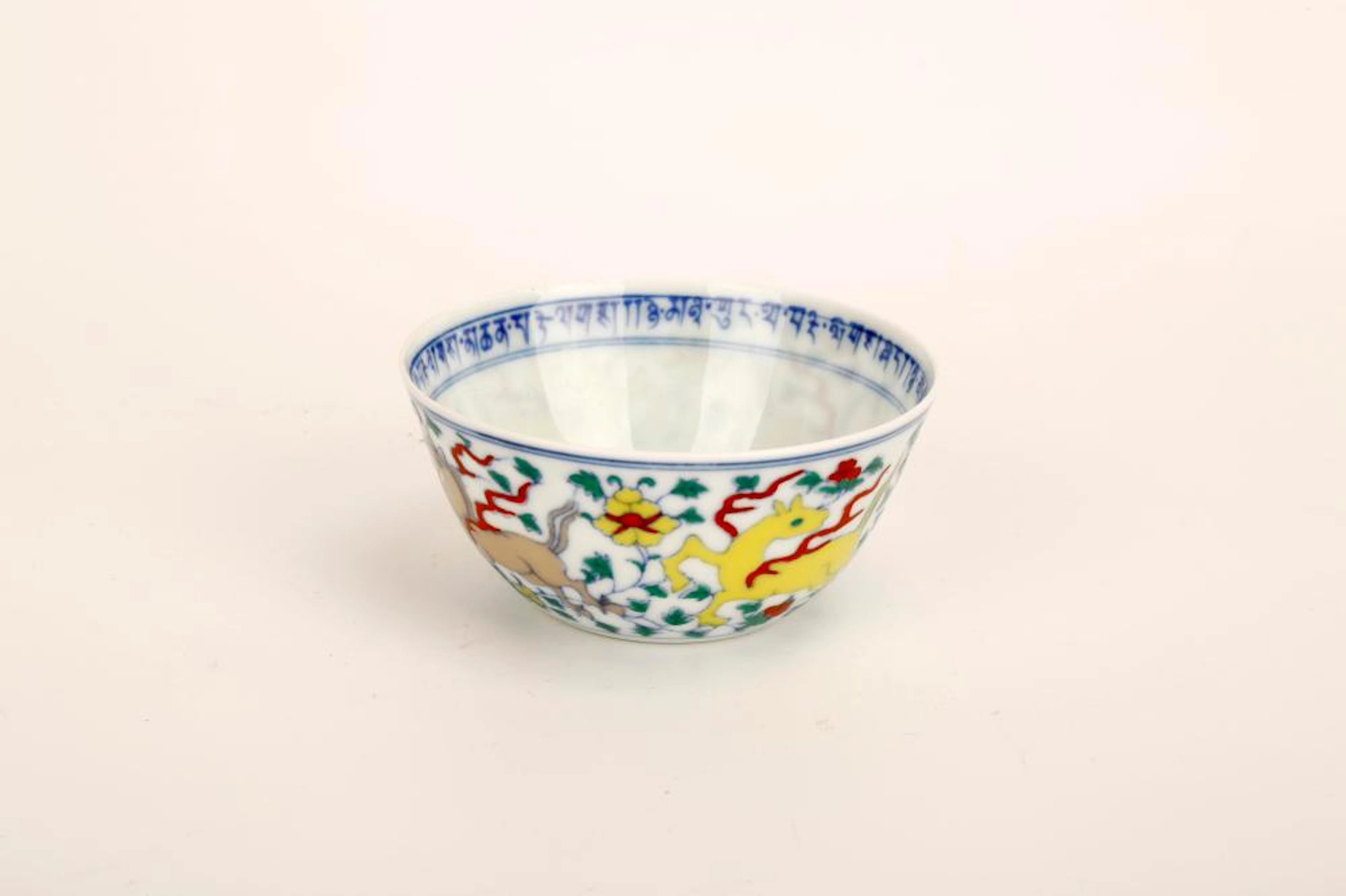 A DOUCAI CUP WITH "DA MING CHENG HUA NIAN ZHI" BLUE...