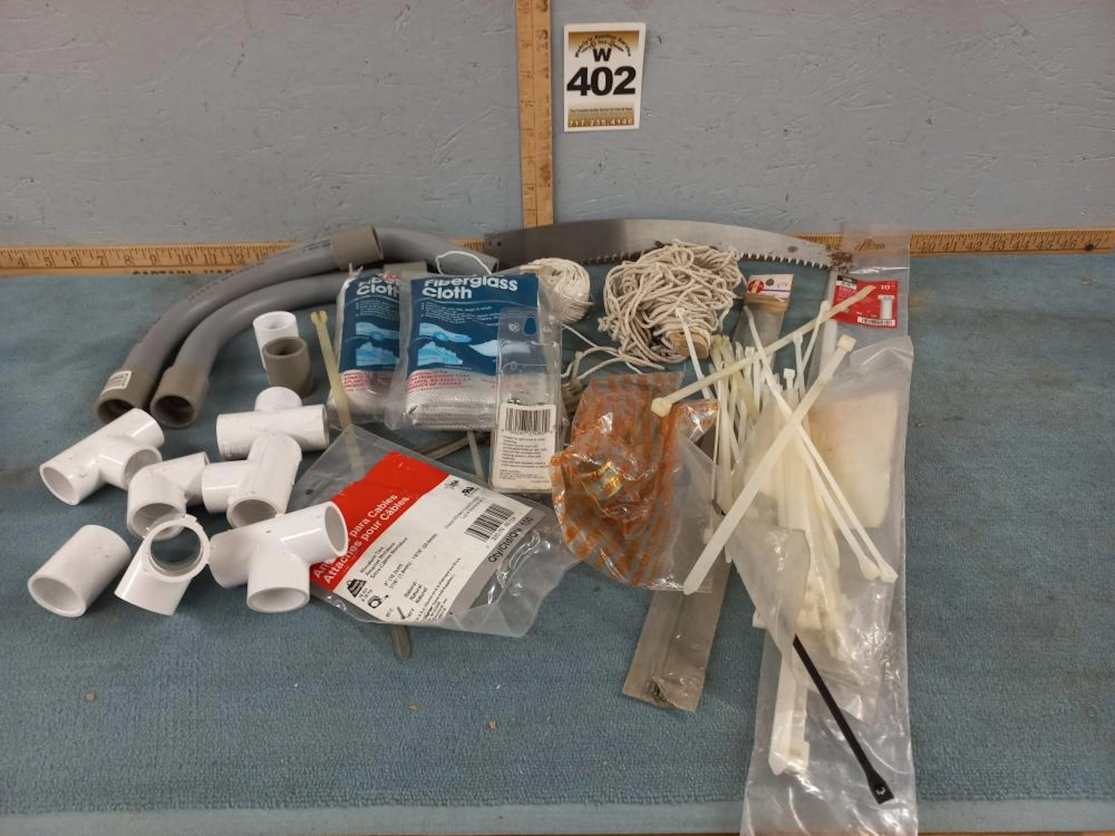 Misc Box Fiberglass Cloth, Zip Ties, Saw Blade
