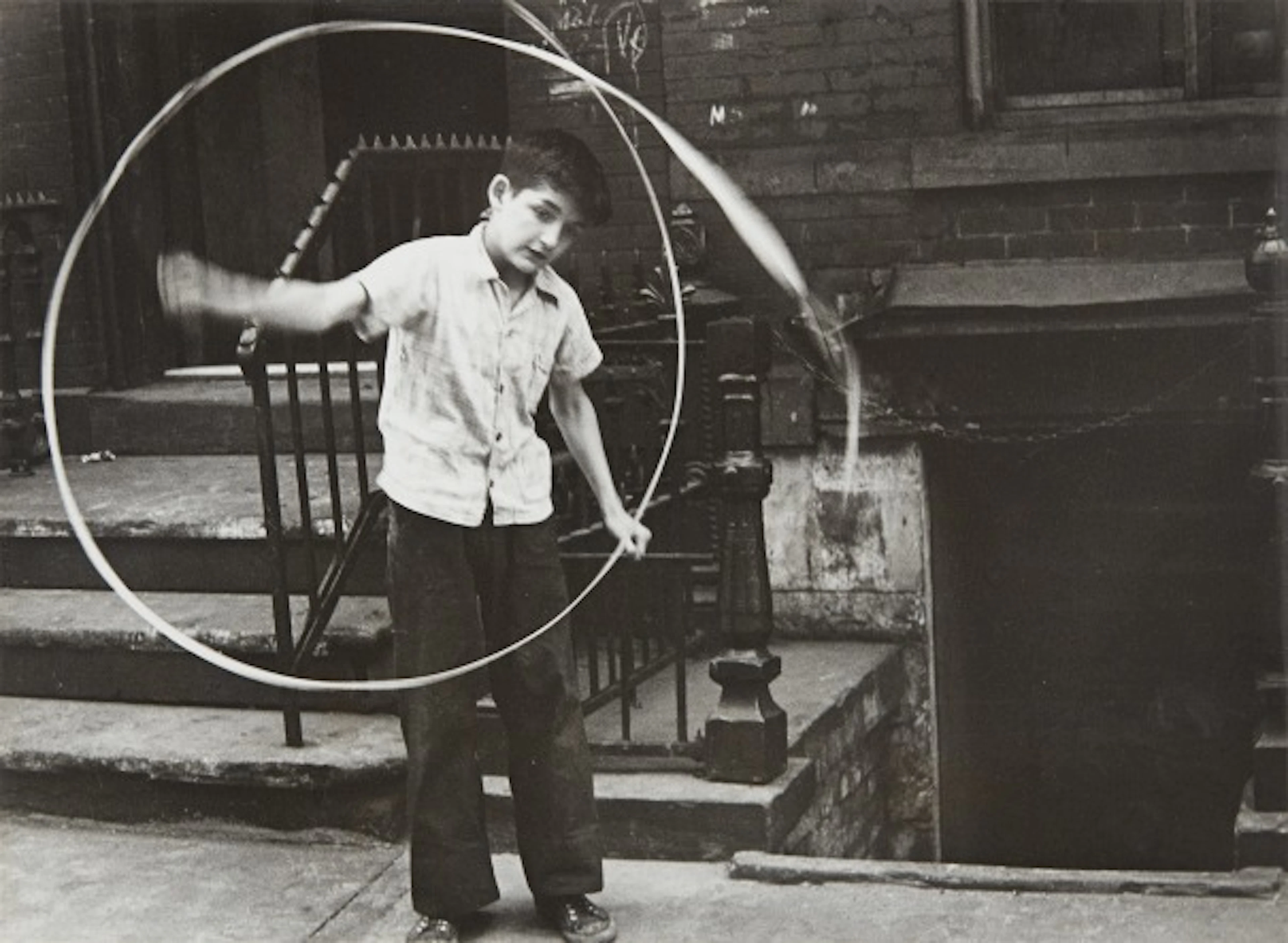 Helen Levitt - N.Y. (boy spinning ribbon)