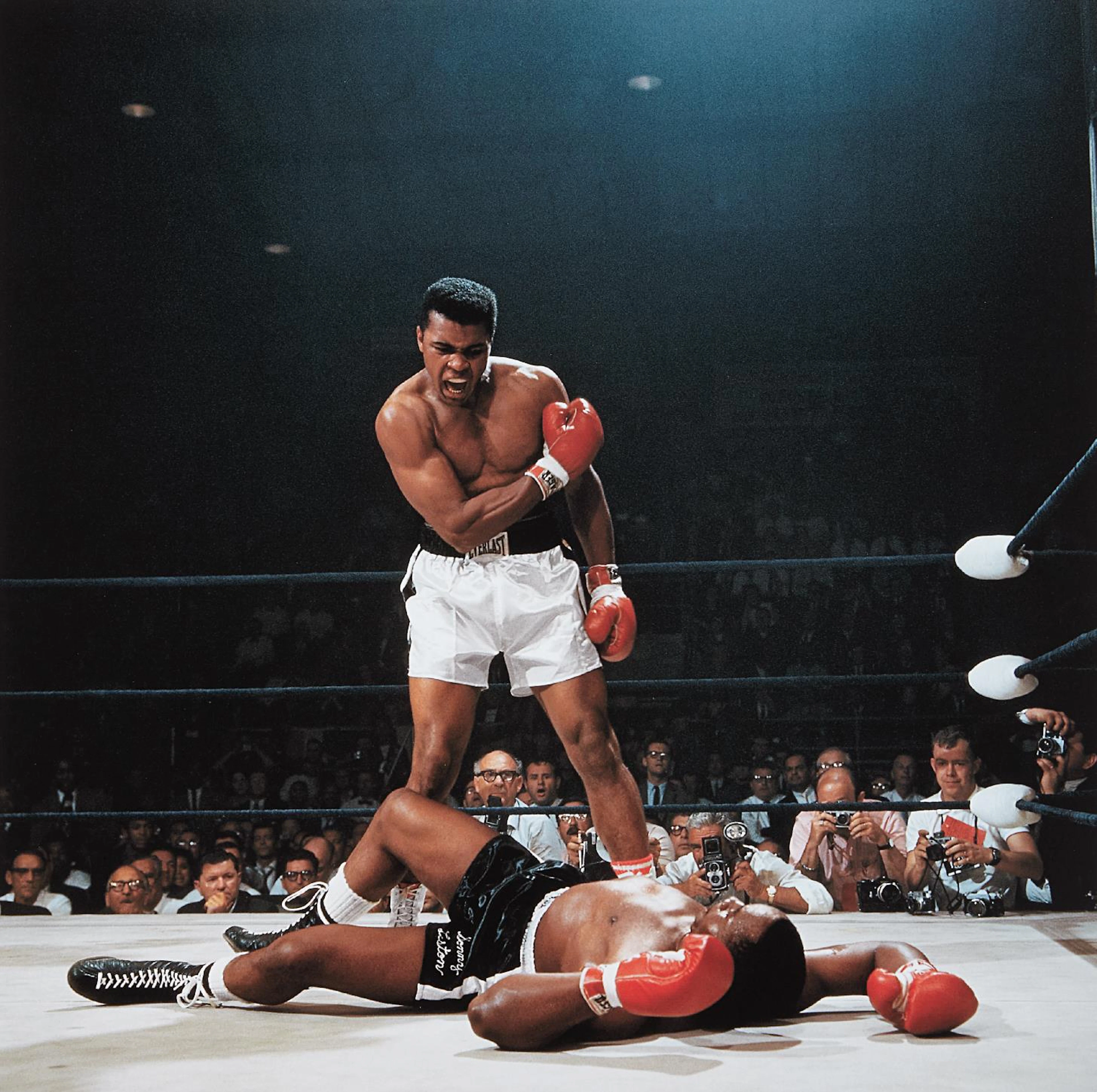 Muhammad Ali reacts after his first round knockout of Sonny Liston during the 1965 World Heavyweight Title fight at St