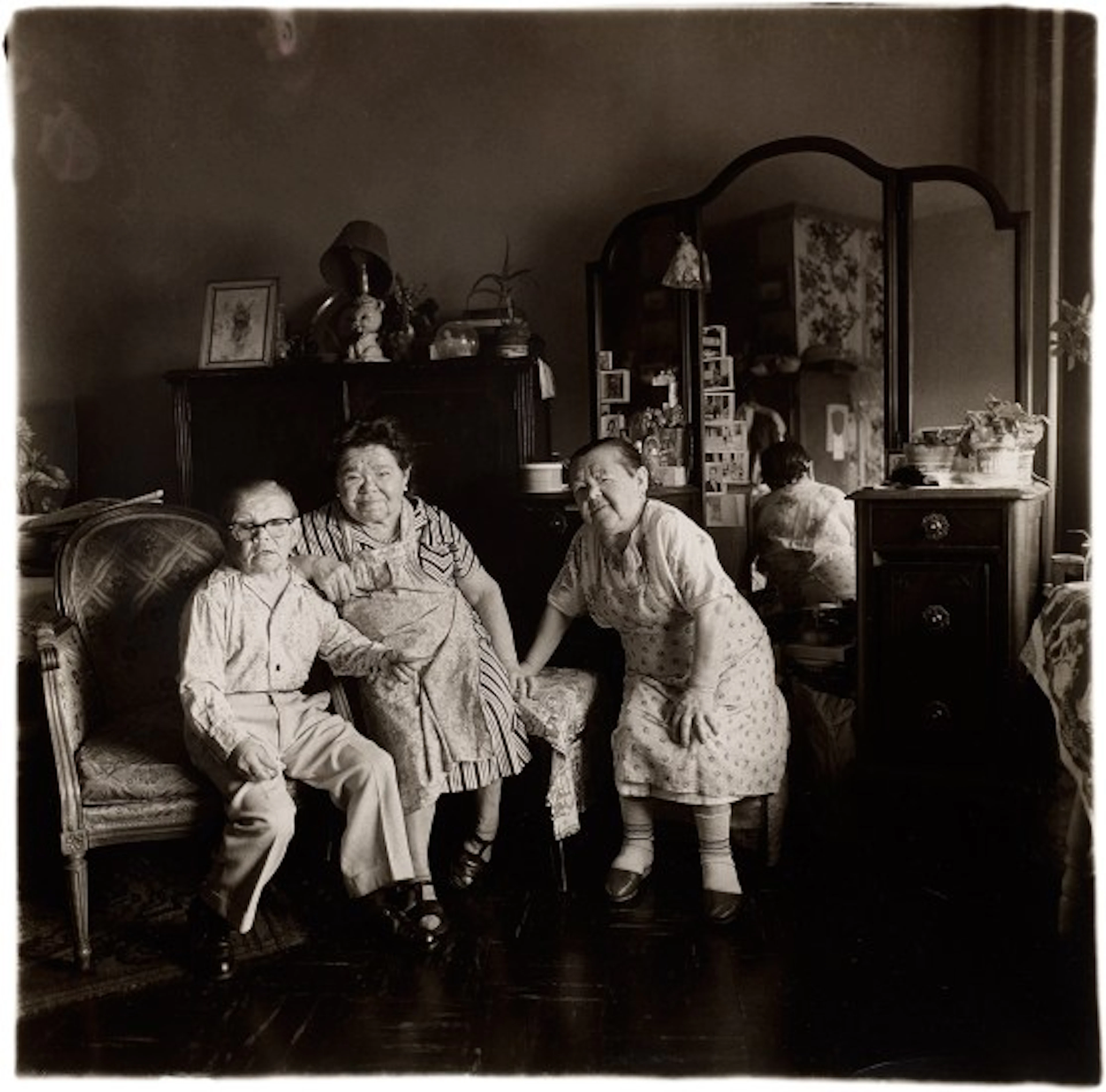 Diane Arbus - Russian Midget Friends in a Living Room on 100th St, NYC