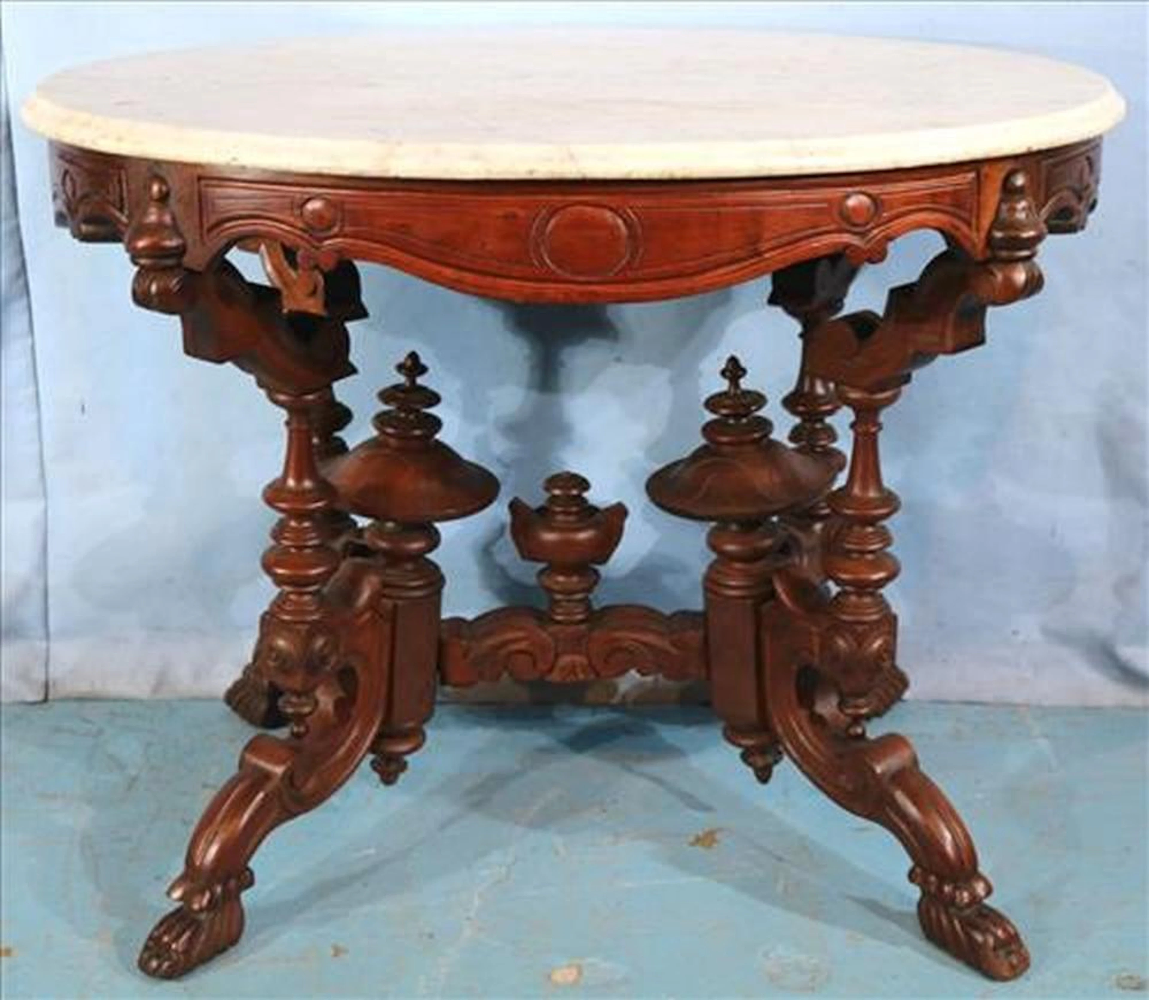 Walnut Victorian center table by Thomas Brooks