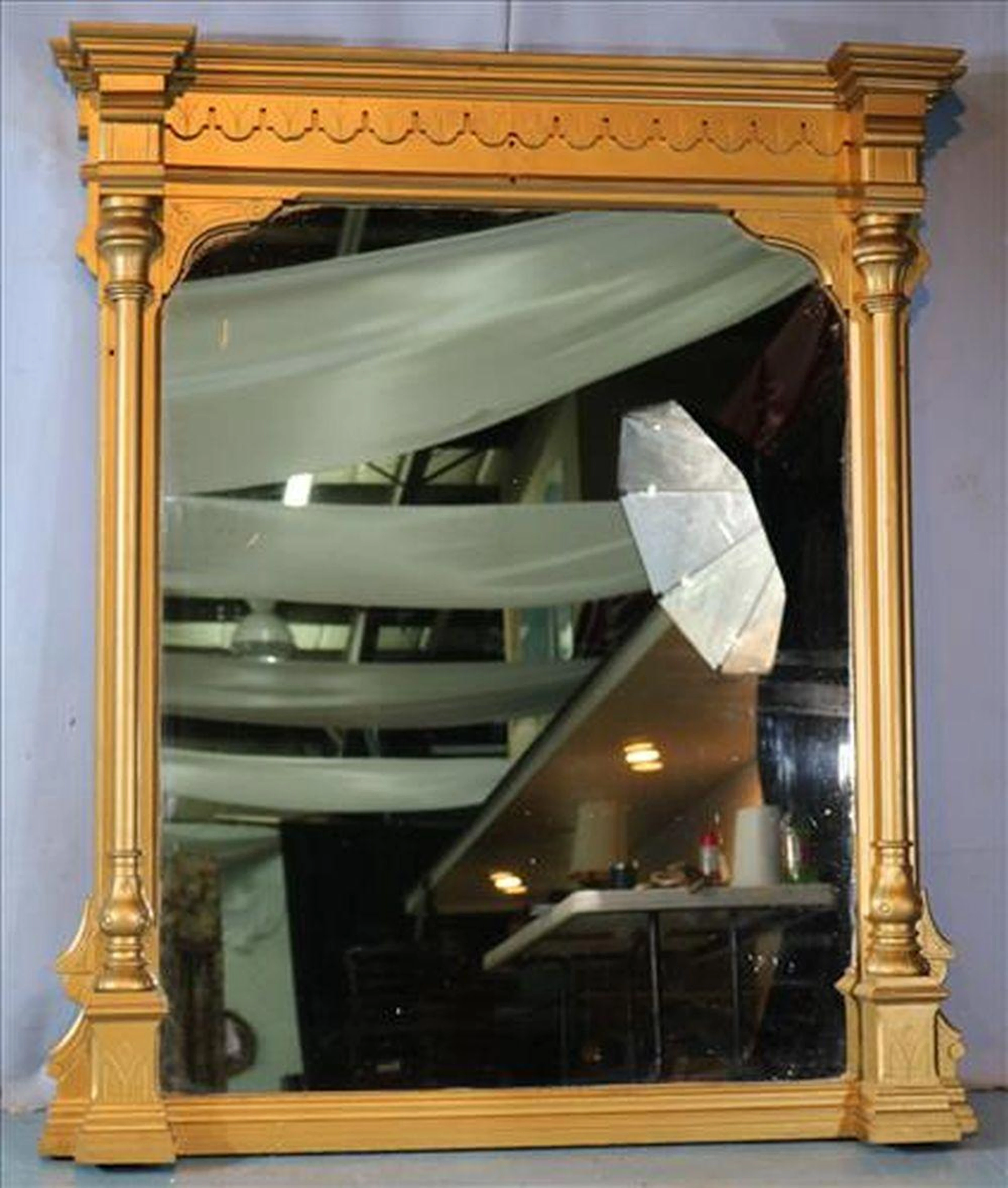 Gold gilded over the mantle mirror with columns