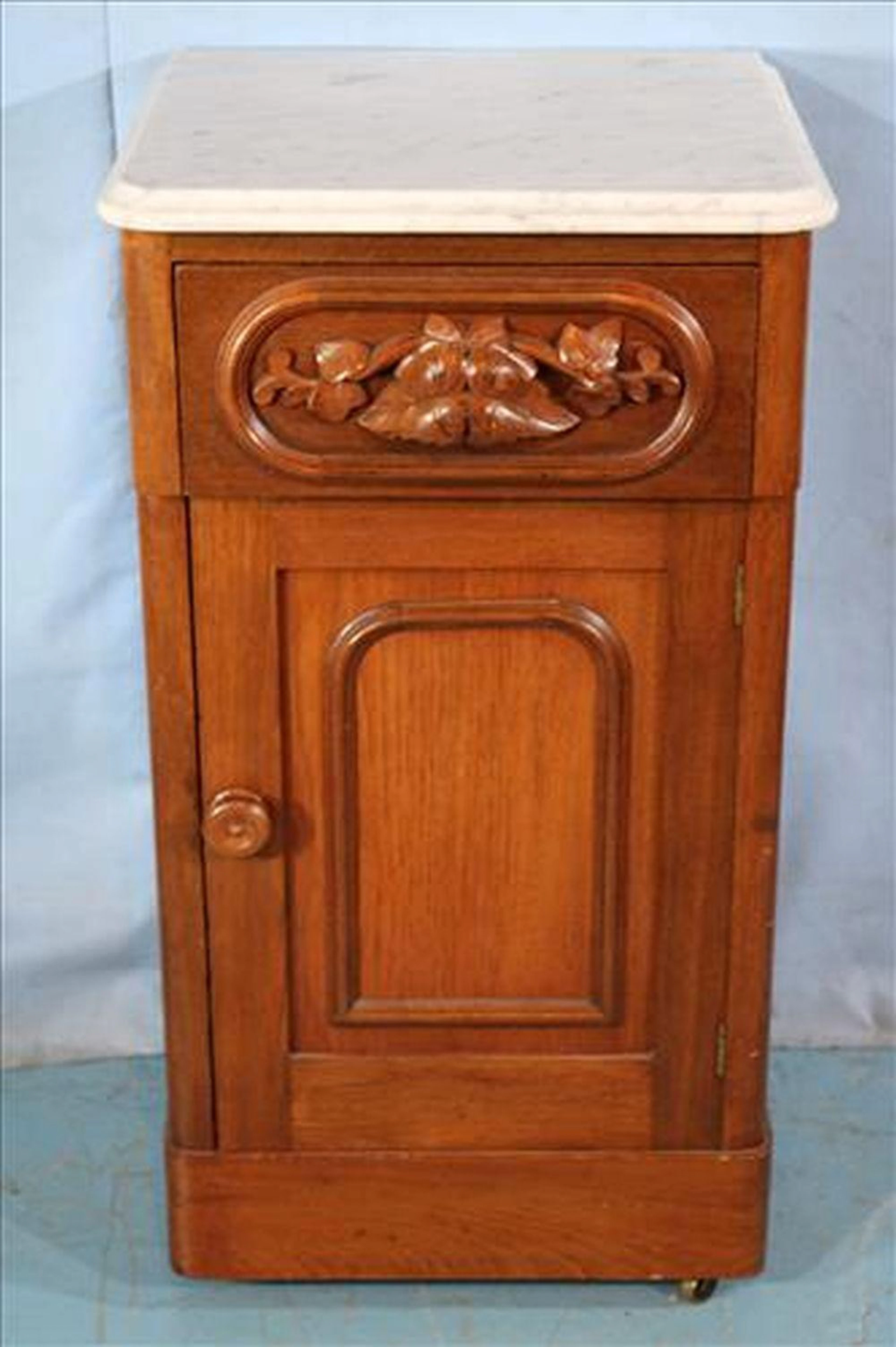 Walnut Victorian half commode with marble top