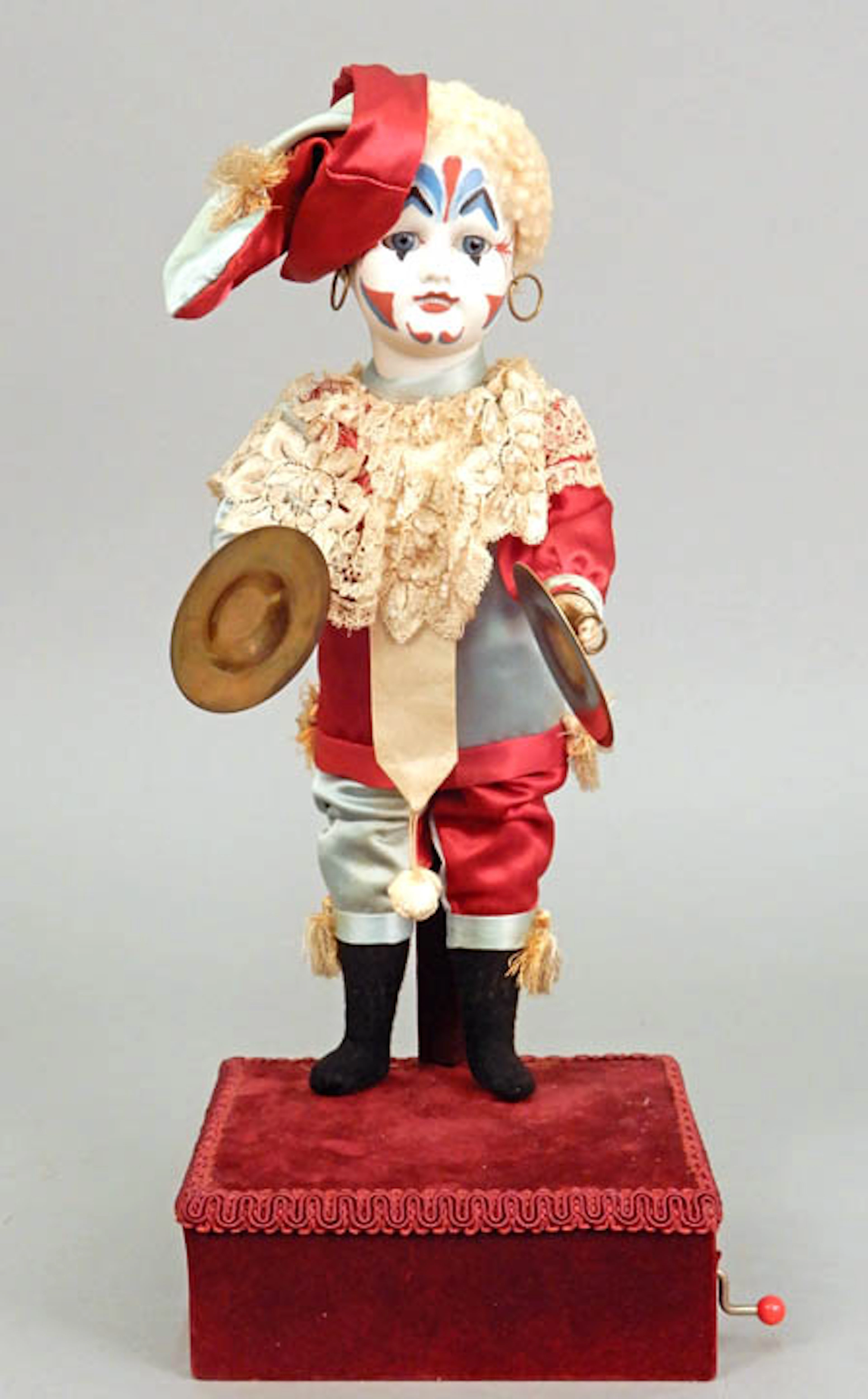 Antique French bisque clown on musical base