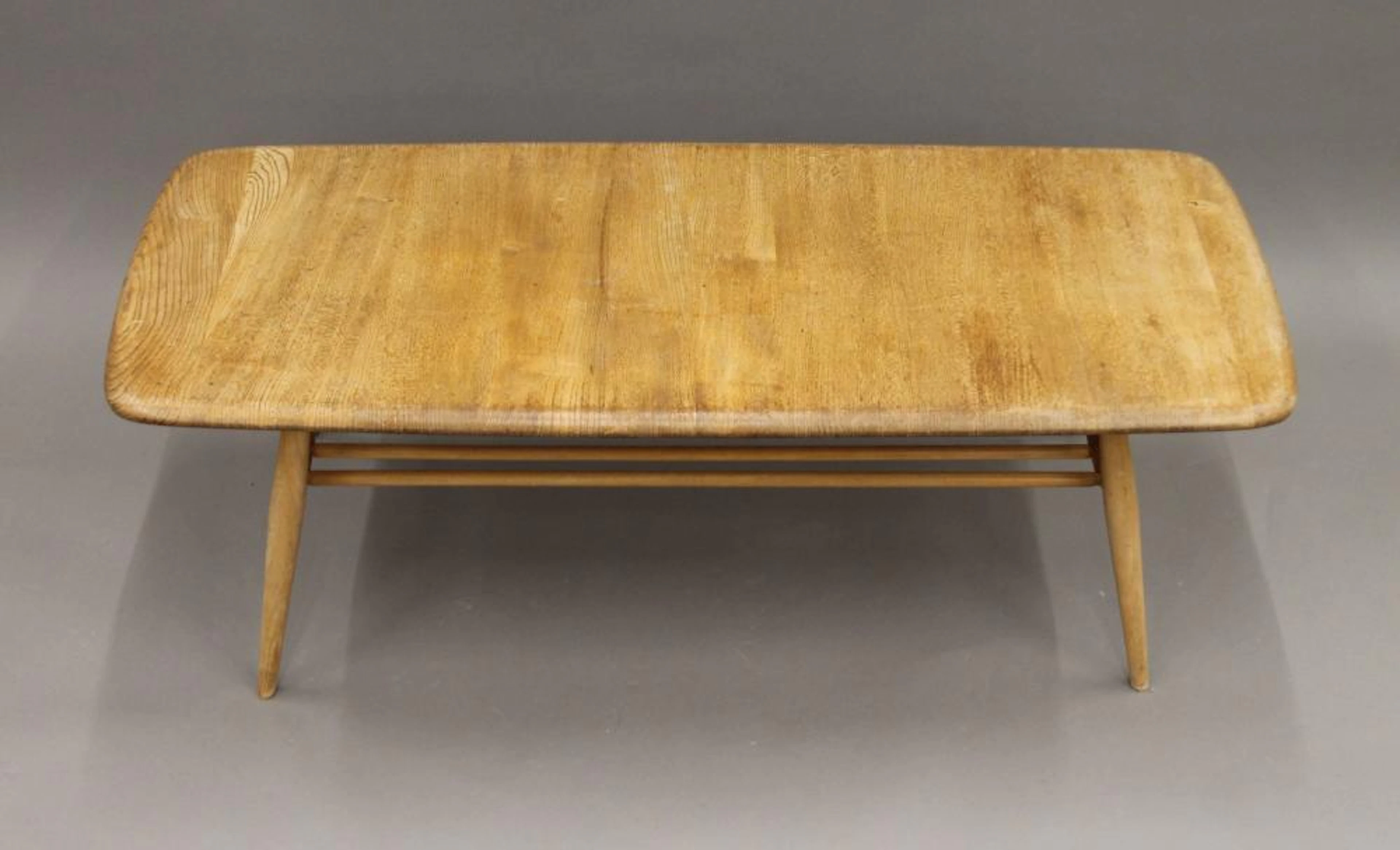 A blonde Ercol coffee table. 104 cm long.