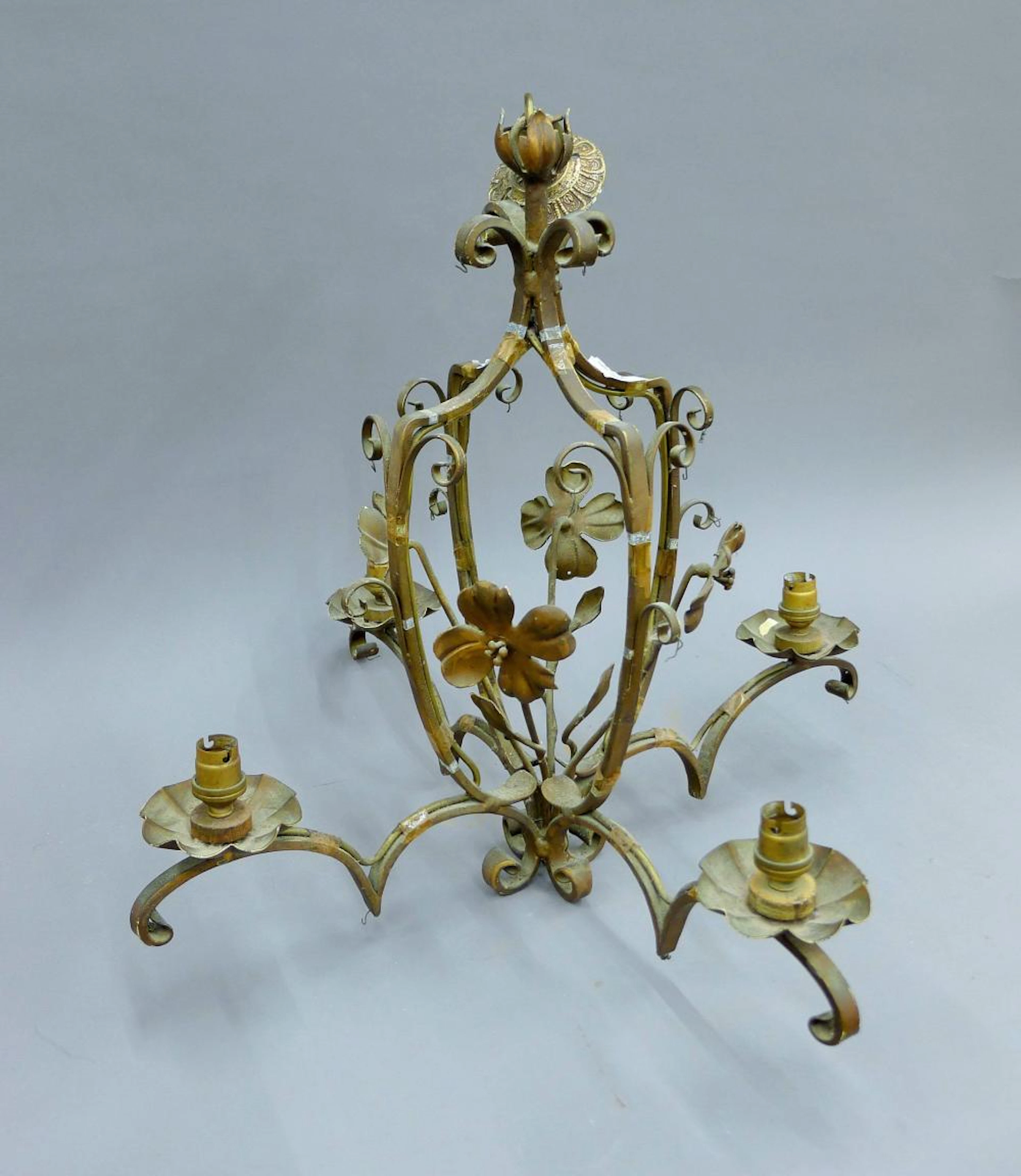 A vintage wrought iron chandelier. 59 cm high.