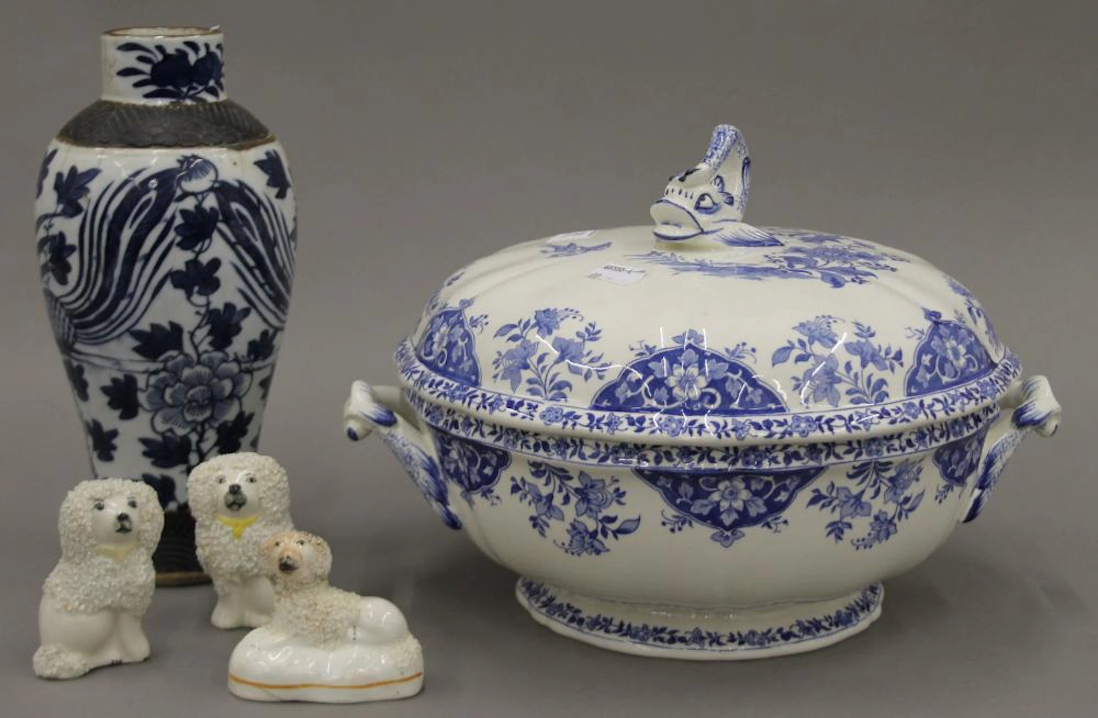A quantity of porcelain, including three Staffordshire dogs, a Chinese blue
