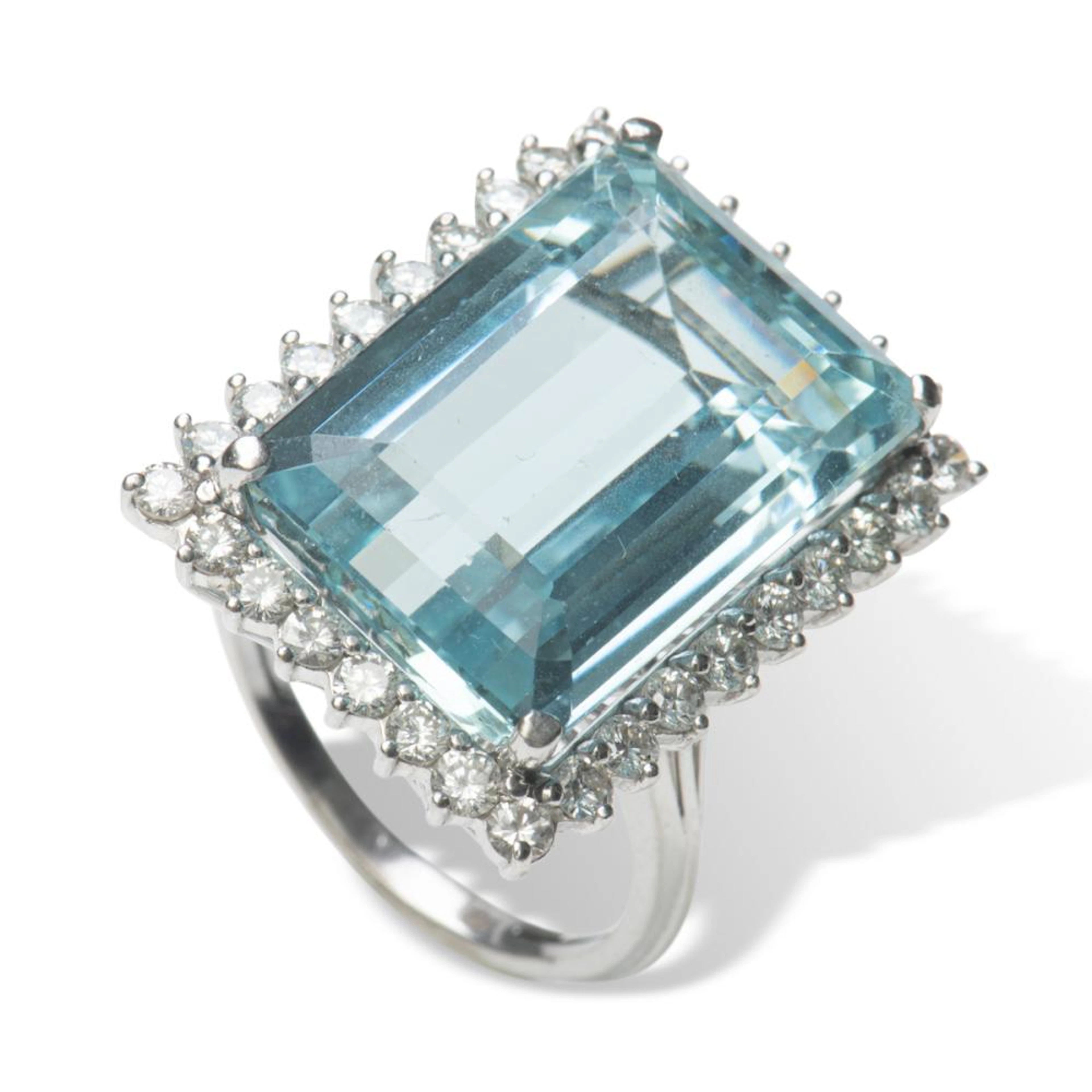 An aquamarine and diamond ring.