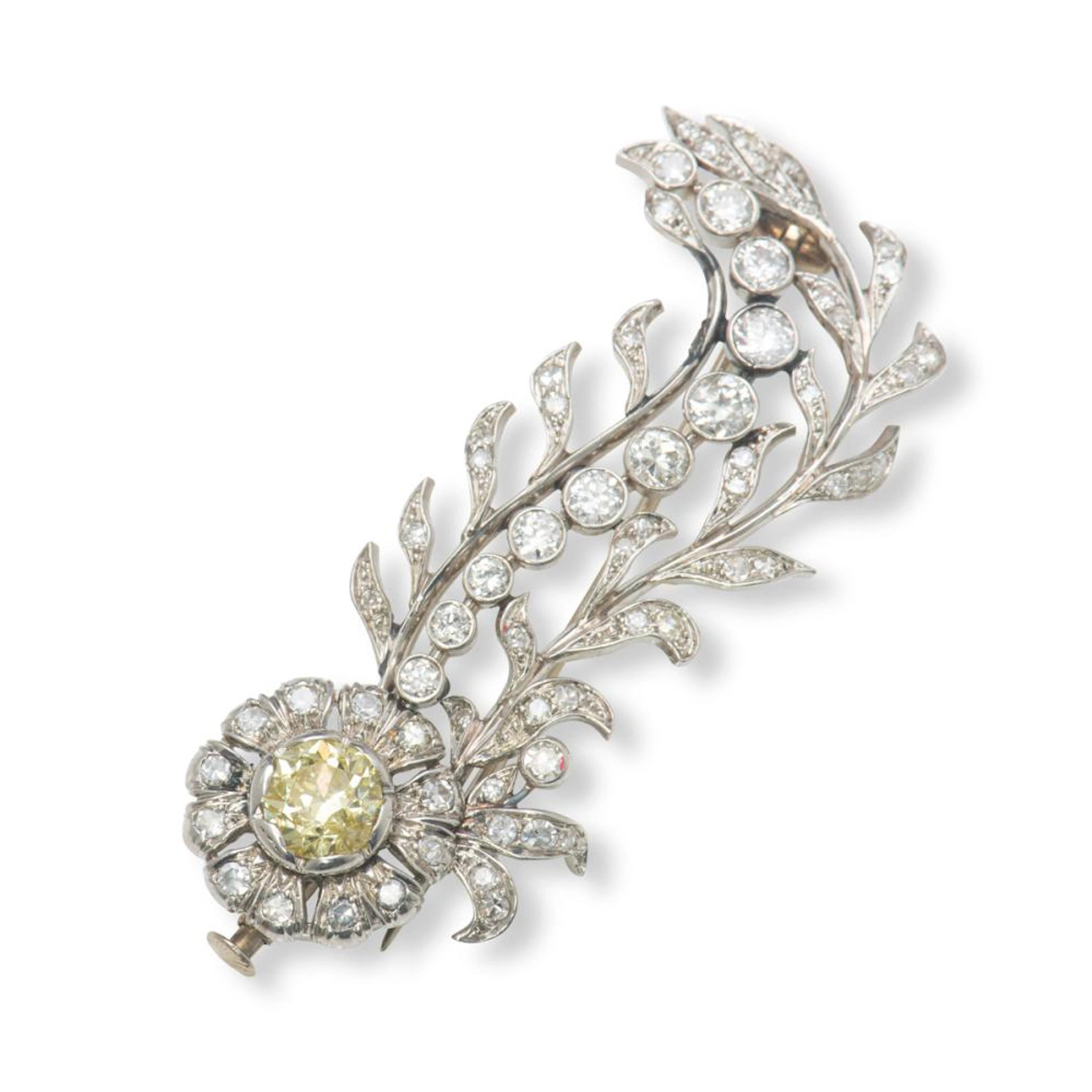 A diamond and coloured diamond brooch.
