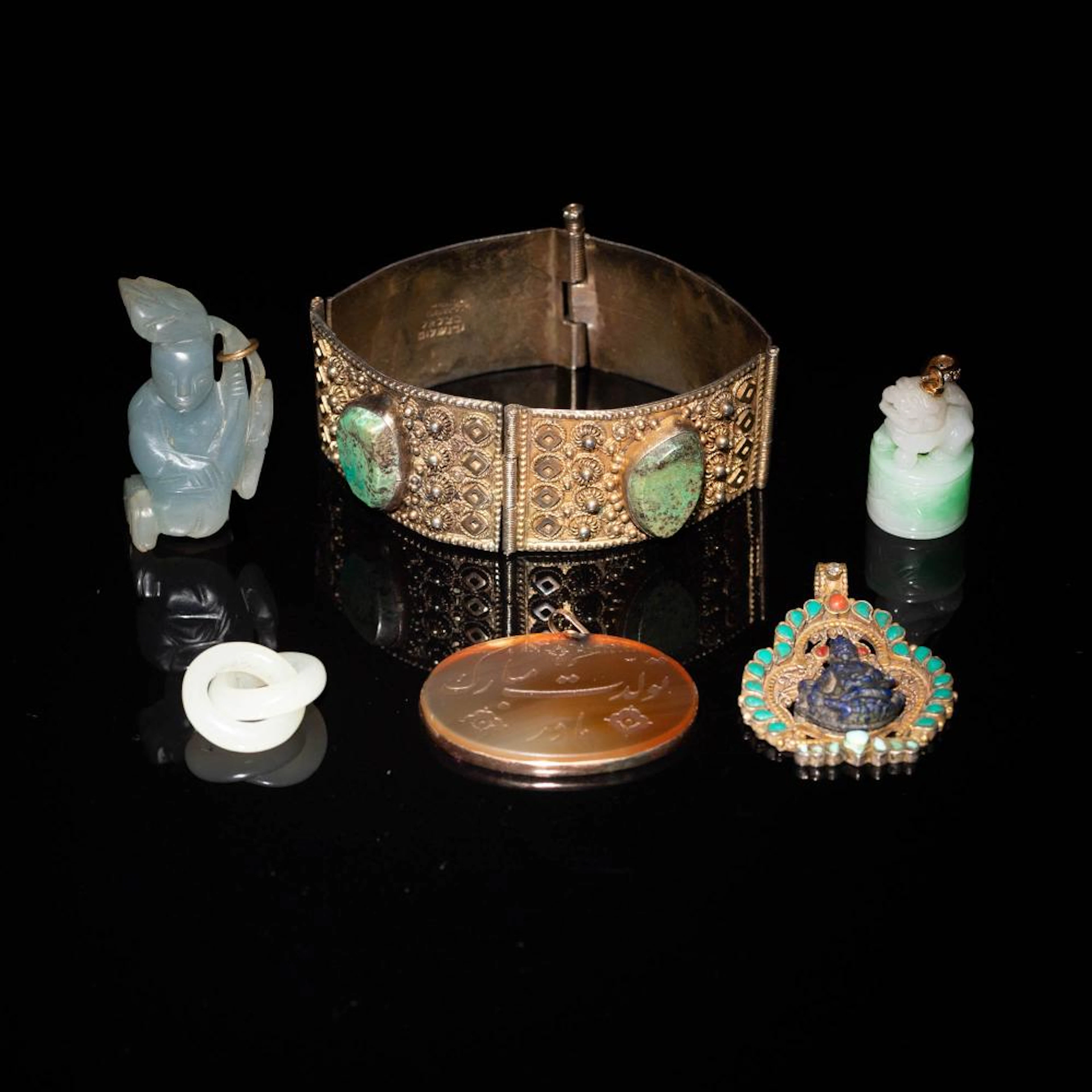 Six assorted carved stone jewelry and toggles, 18th/19th century
