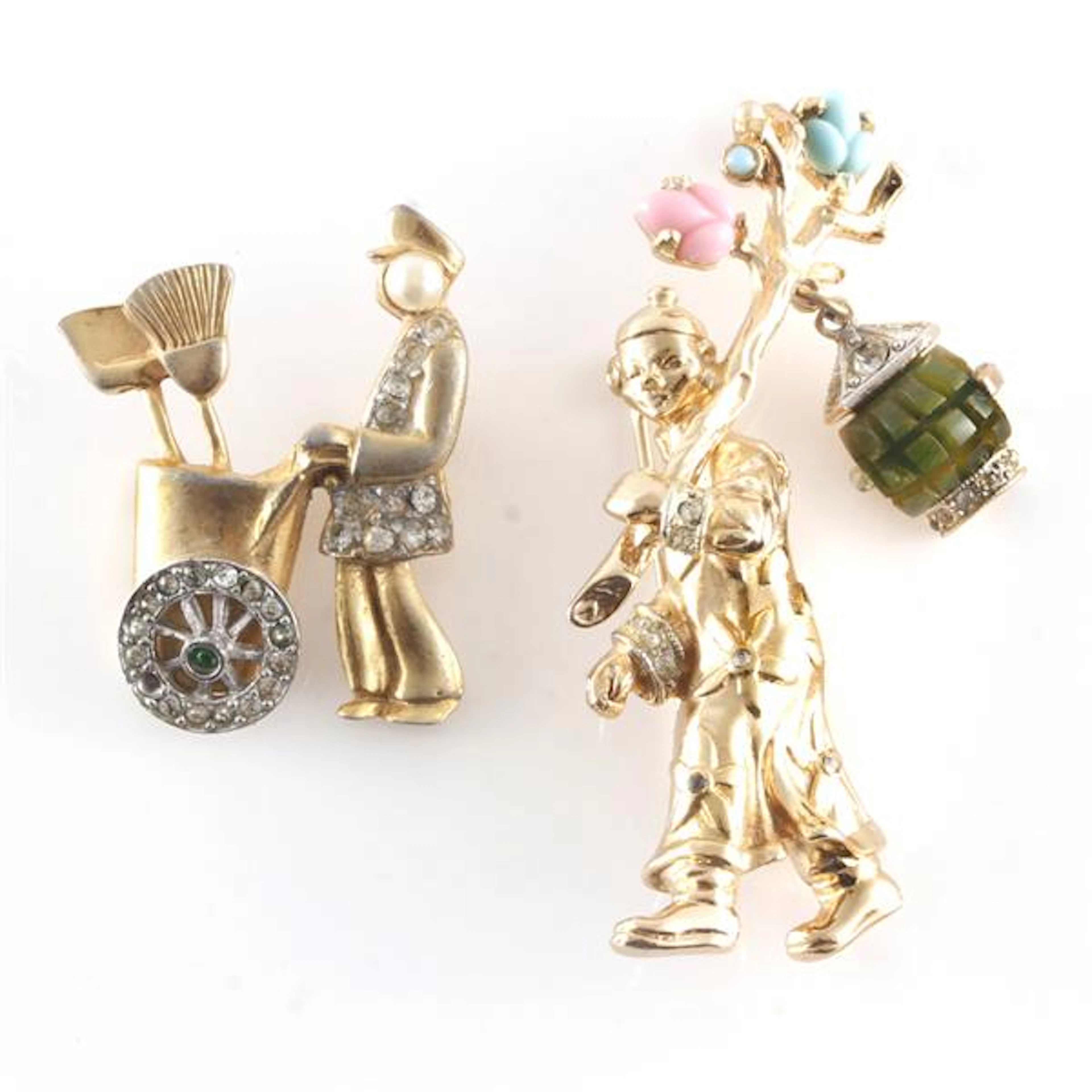 Coro gold tone figural pin brooch carrying a branch with...
