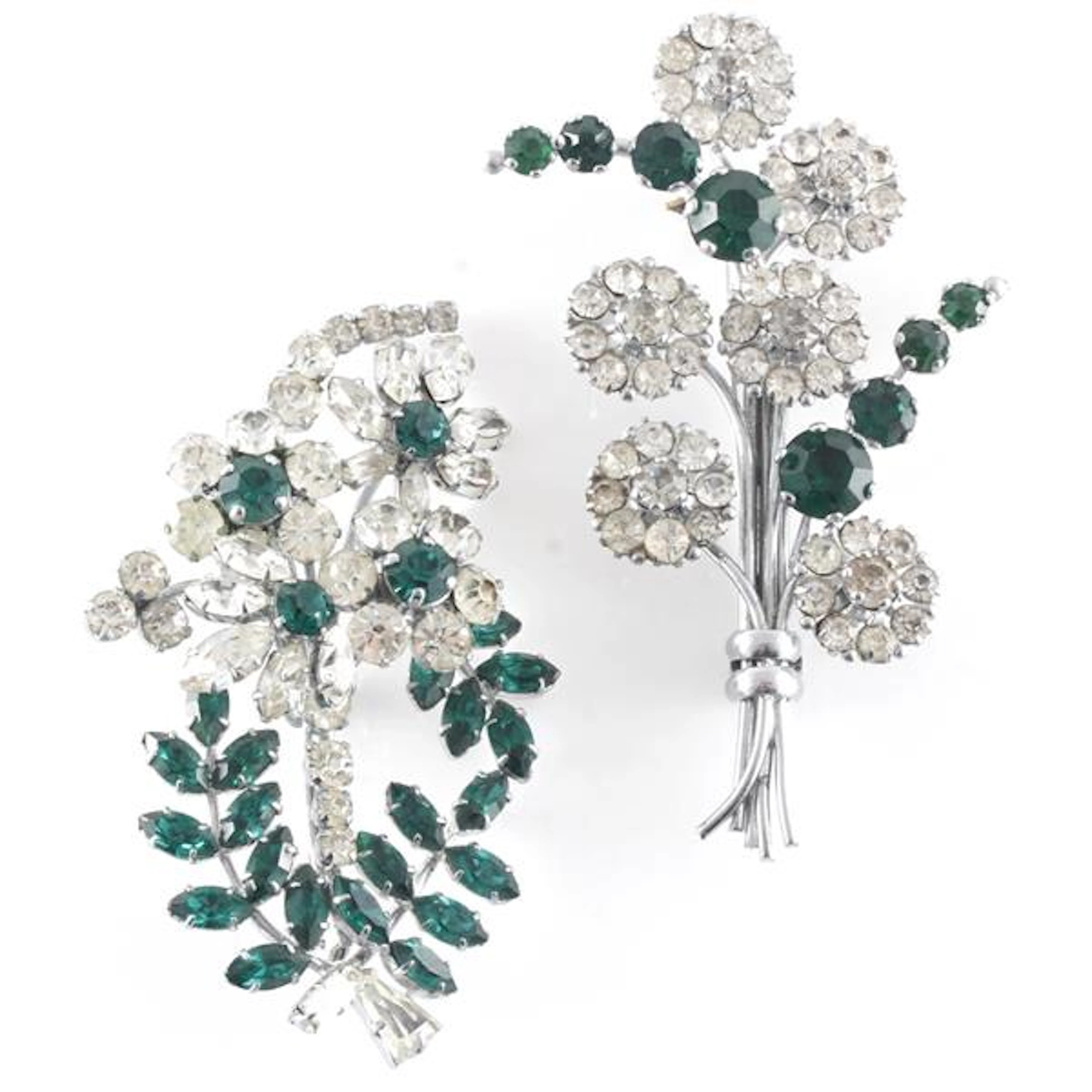 Two 1950s emerald and colorless crystal pins: Made in...