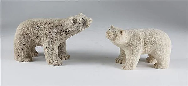 TWO FOSSILIZED WHALE BONE SCULPTURES - Two polar bears...