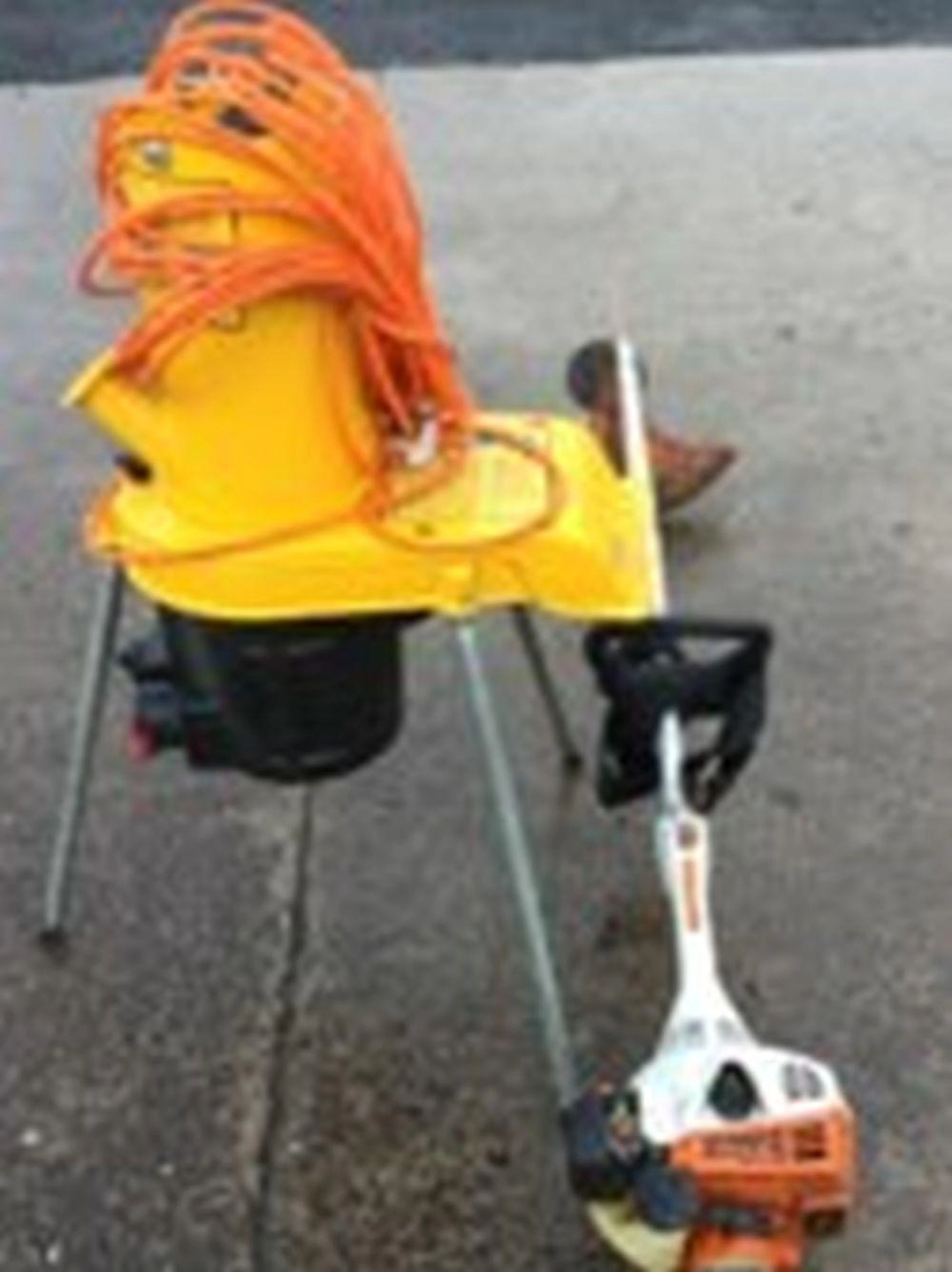 An Al-ko Kober electric garden shredder on three angled legs; and a Stihl