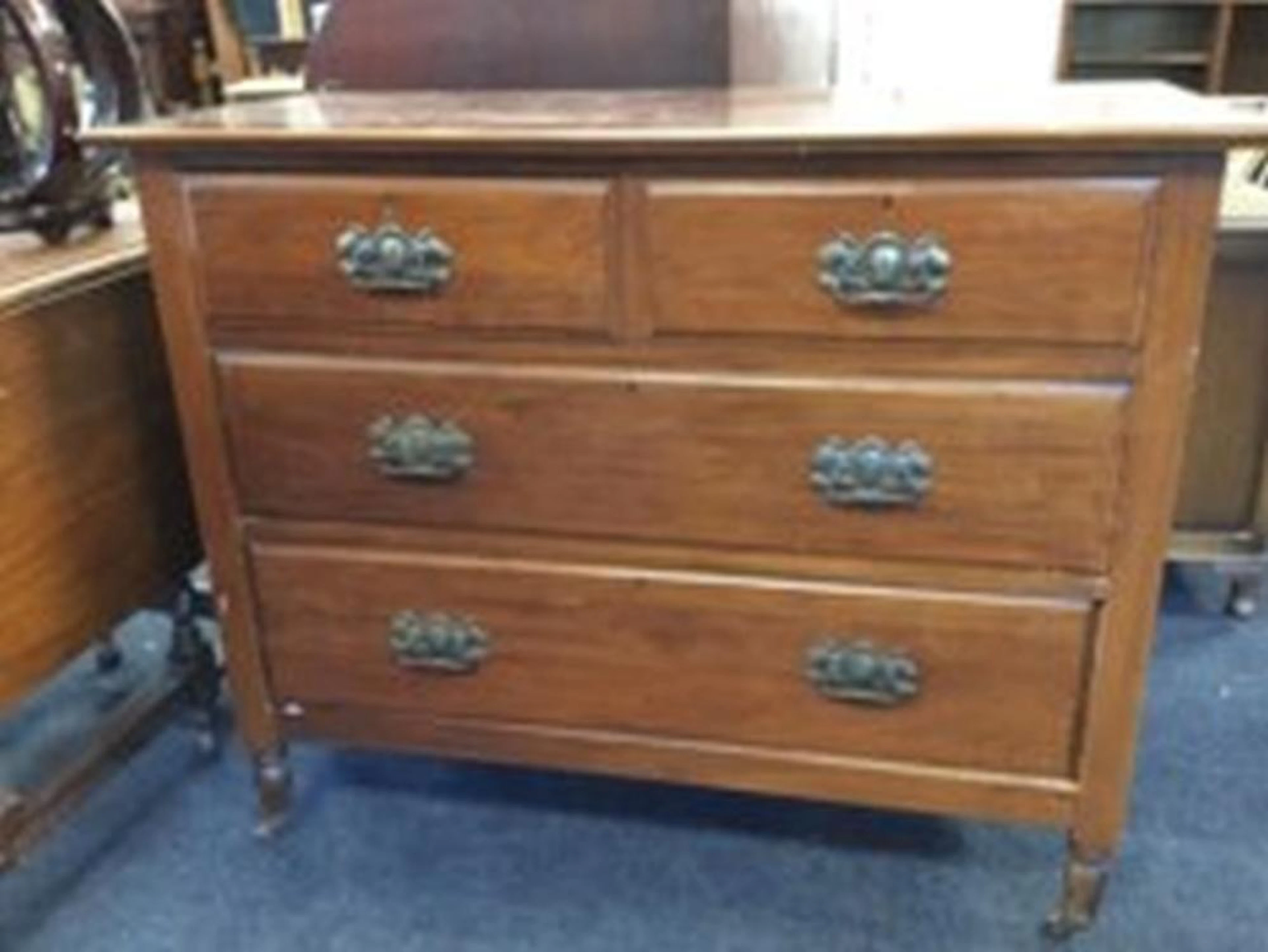 A late Victorian mahogany chest of drawers, the moulded rectangular top ab