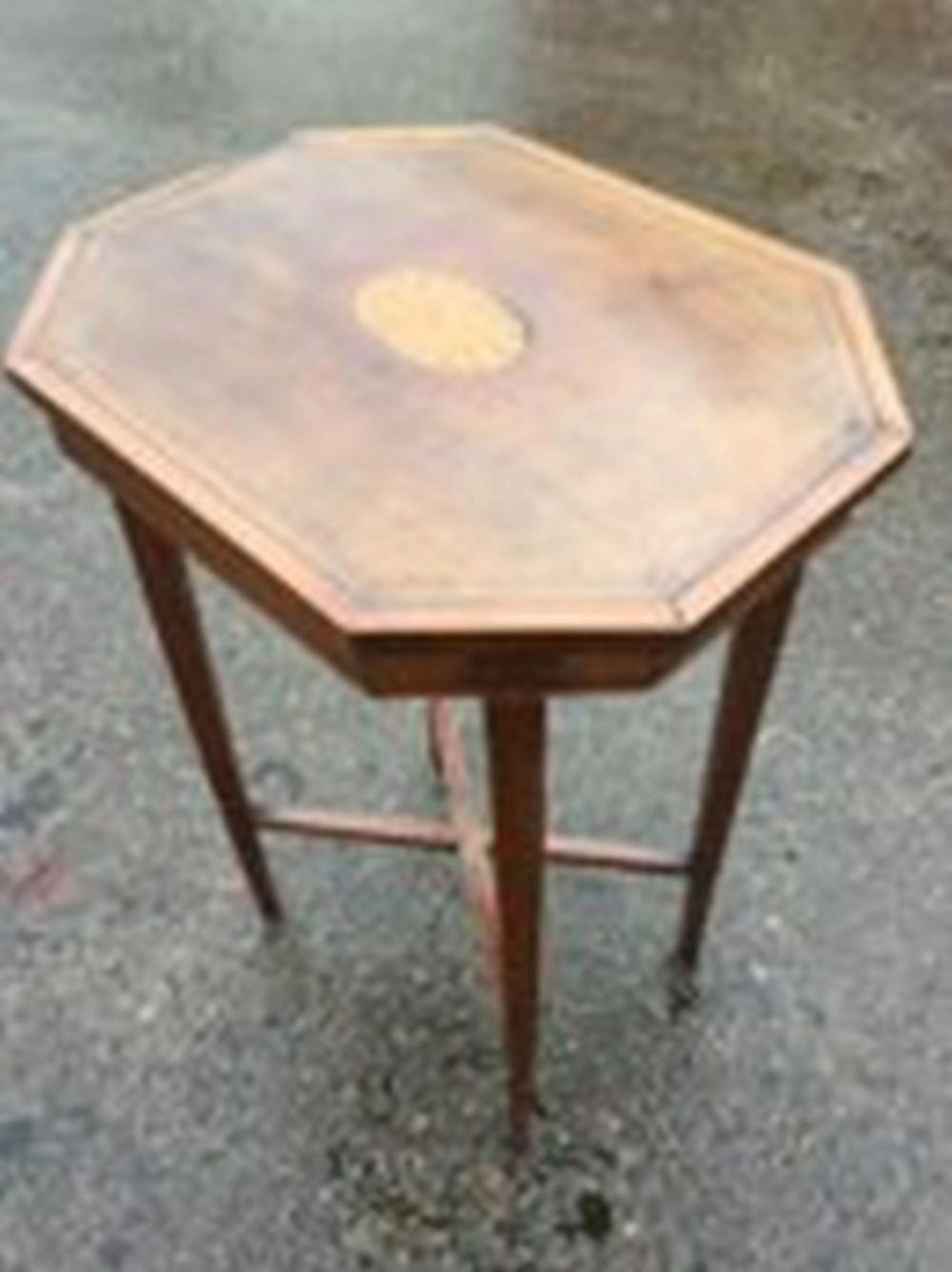 An Edwardian mahogany occasional table, the rectangular octagonal top inla