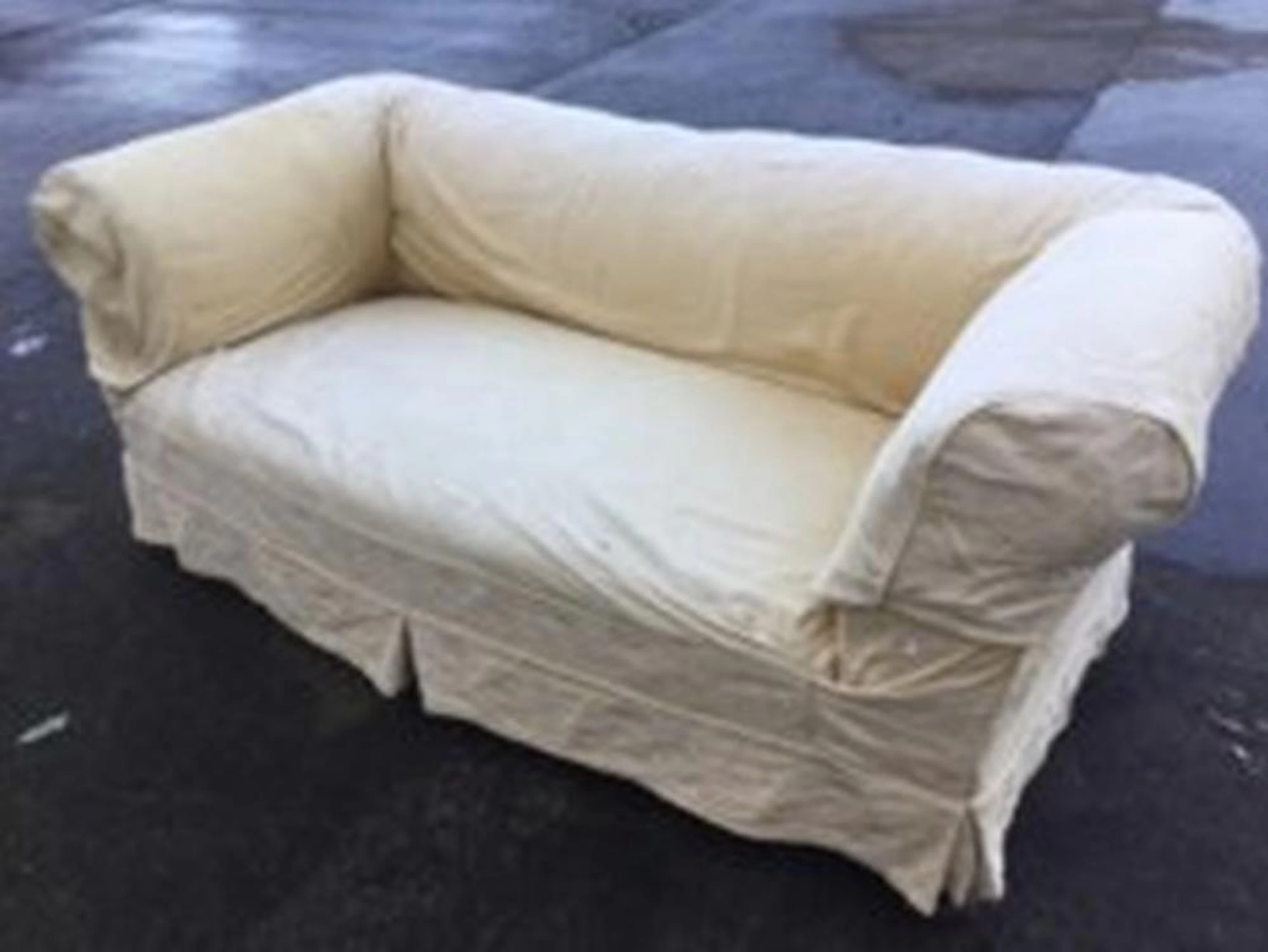 An Edwardian corduroy upholstered chesterfield sofa, with padded back and