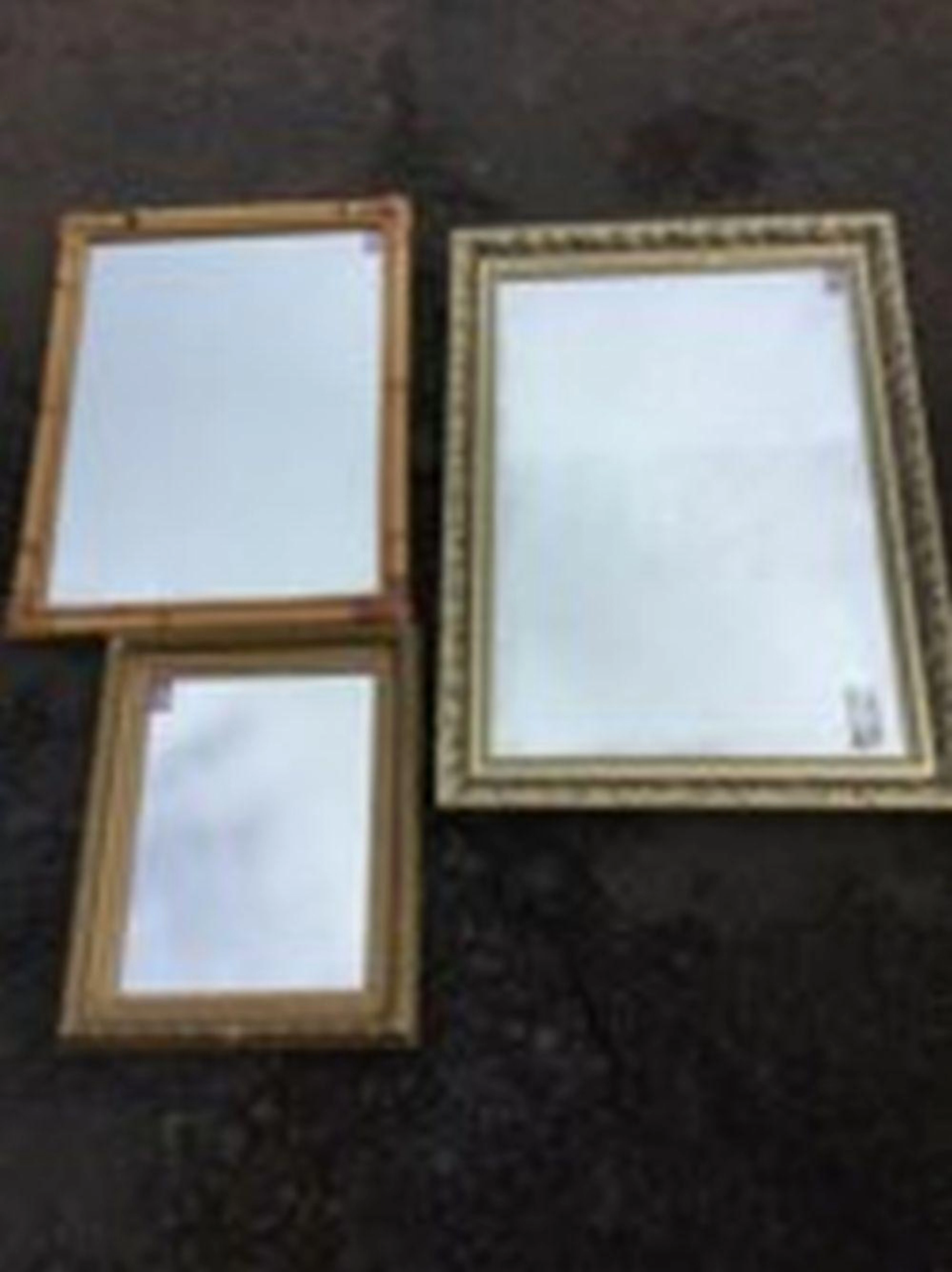 A modern rectangular gilt framed mirror; a bamboo framed mirror; and anothe