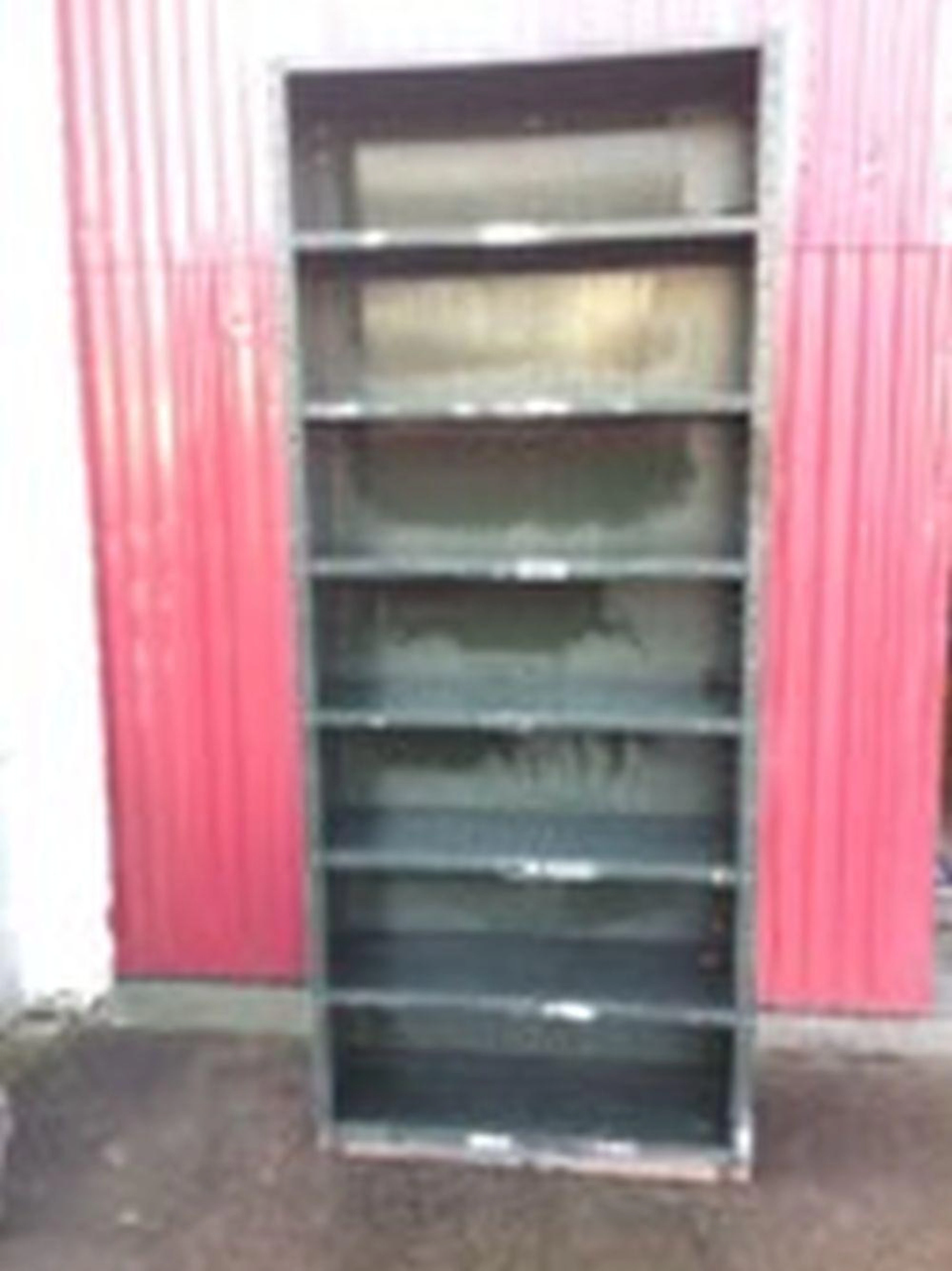 A set of dexion open shelves with seven adjustable platforms. (36in x 12in