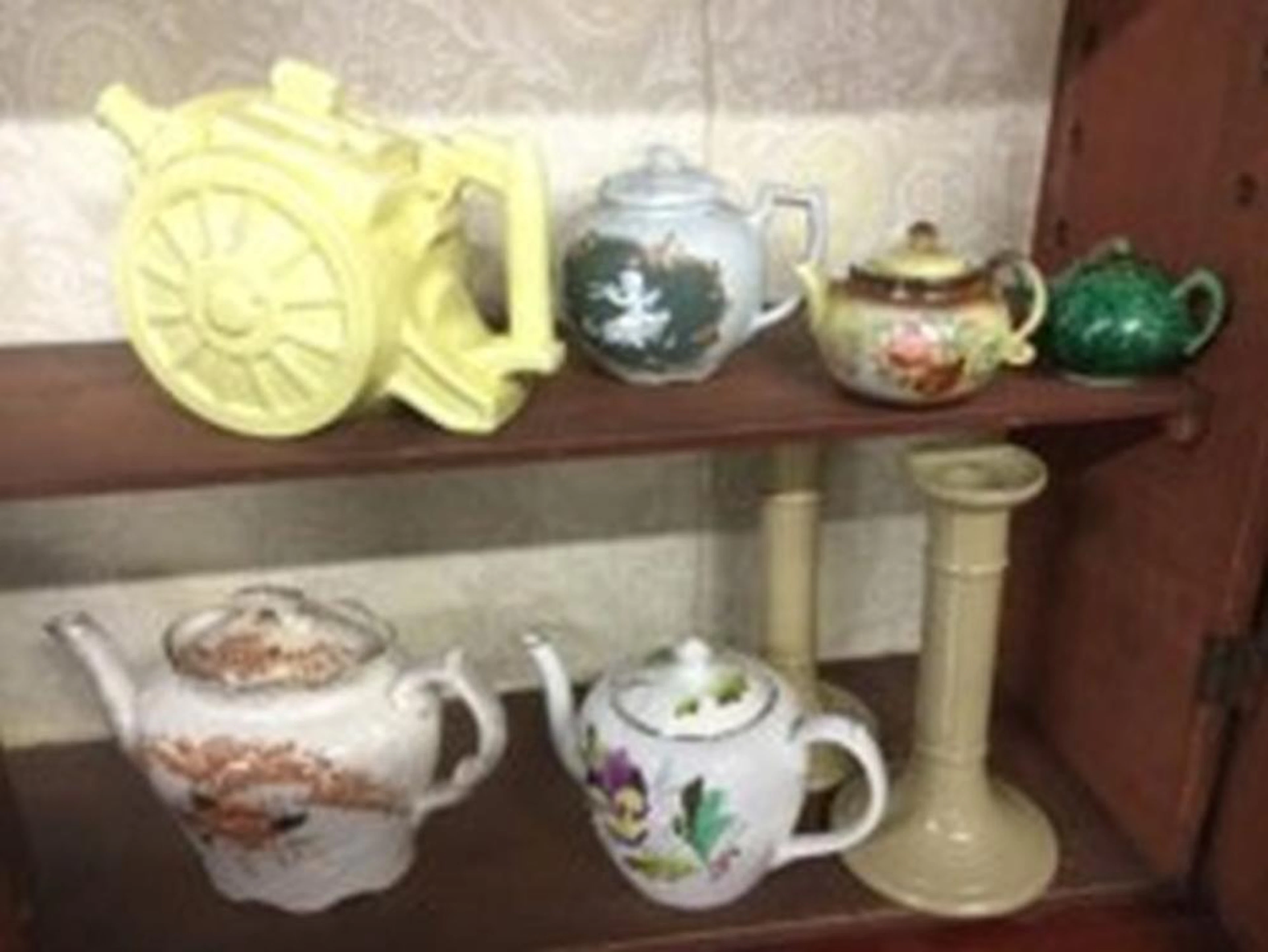 A novelty yellow glazed Belisha teapot modelled in the form of a canon; fi