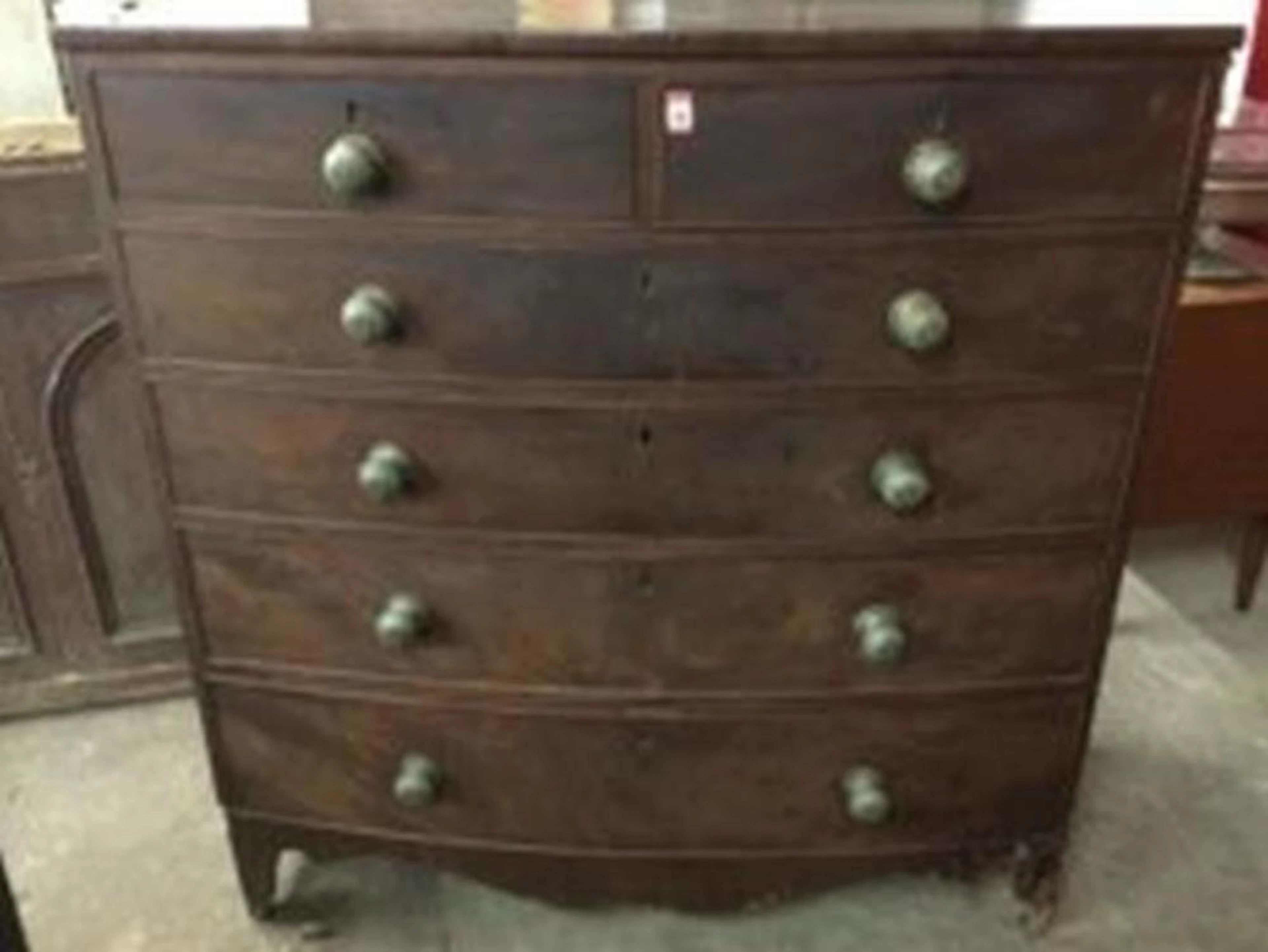 A nineteenth century mahogany bowfronted chest of drawers, with two short a