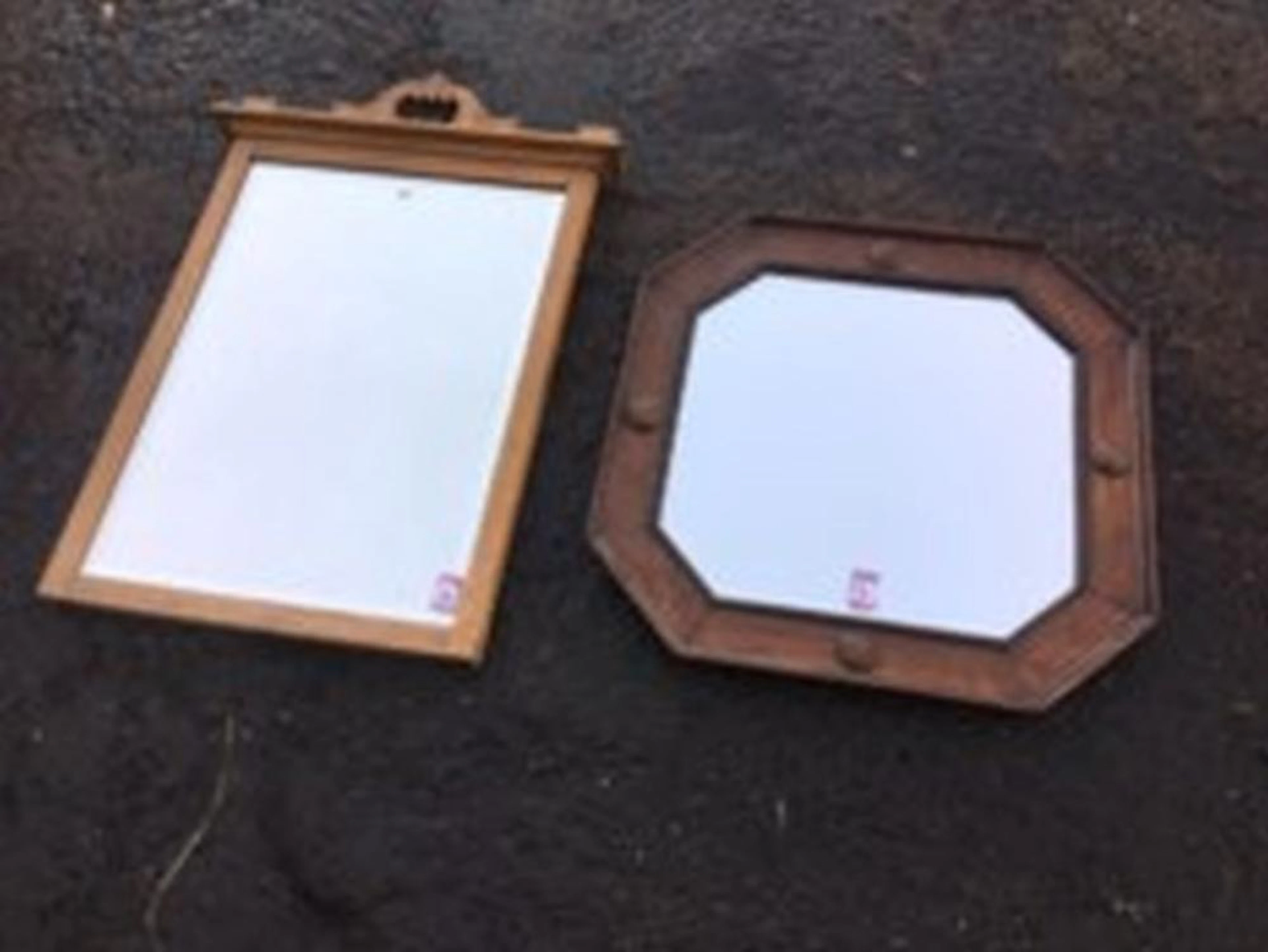 A Victorian oak framed mirror with bevelled plate, the moulded top rail wit