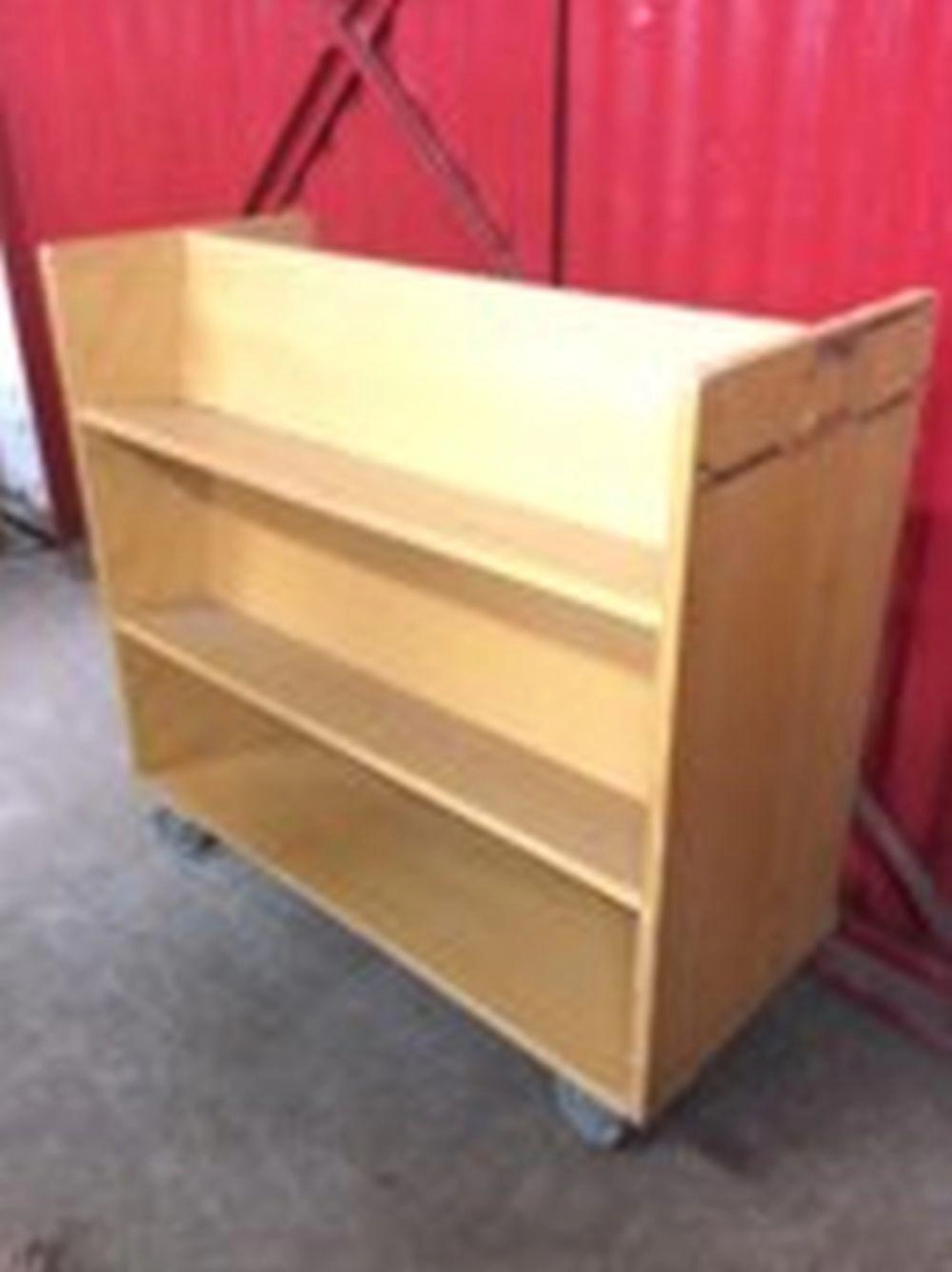 A Gresswell beech book trolley, the rectangular cabinet with three shelves