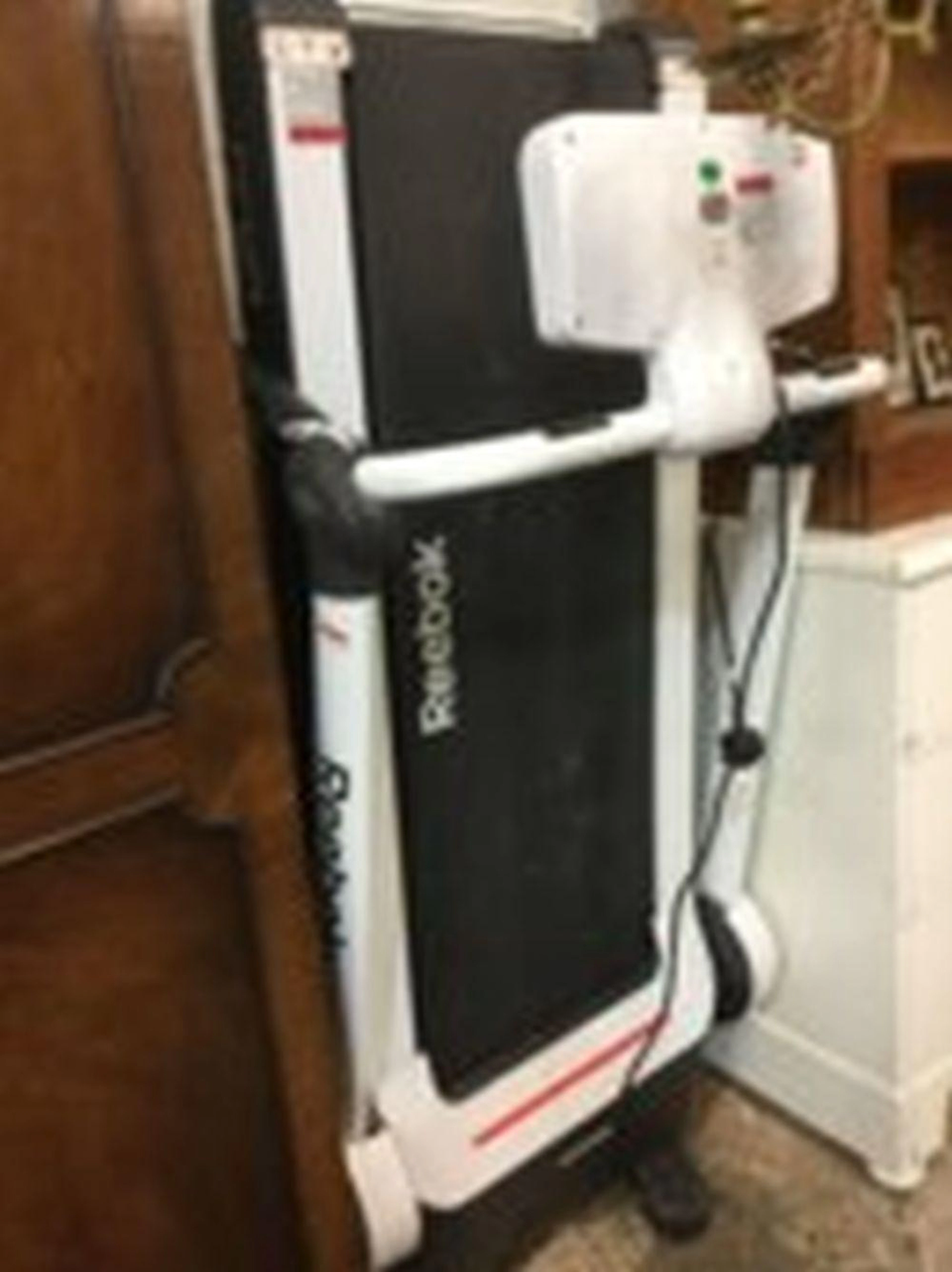A Reebok electric running track machine, the portable exercise piece on ca