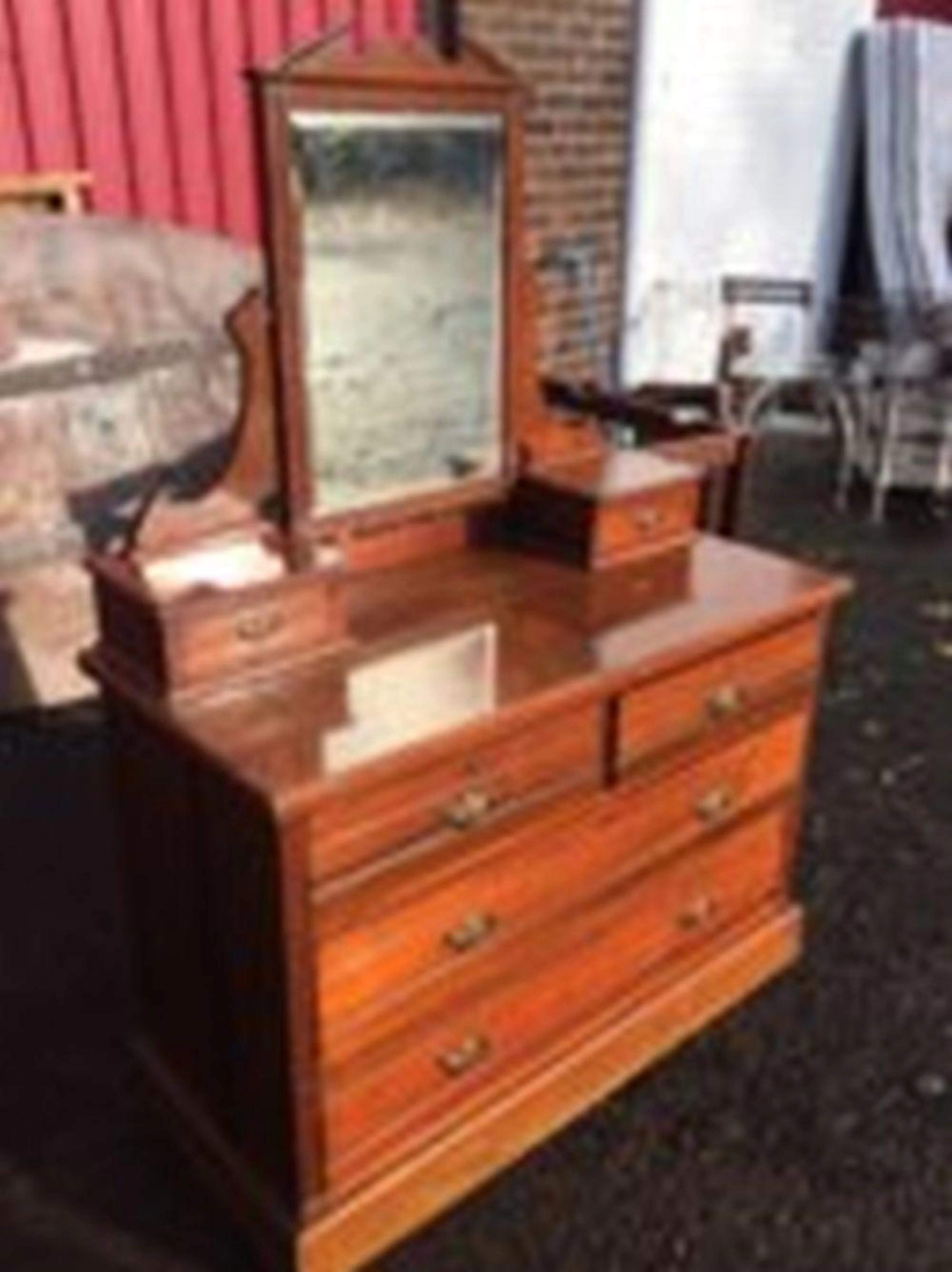 A late Victorian mahogany dressing table, the back with bevelled pedestal m