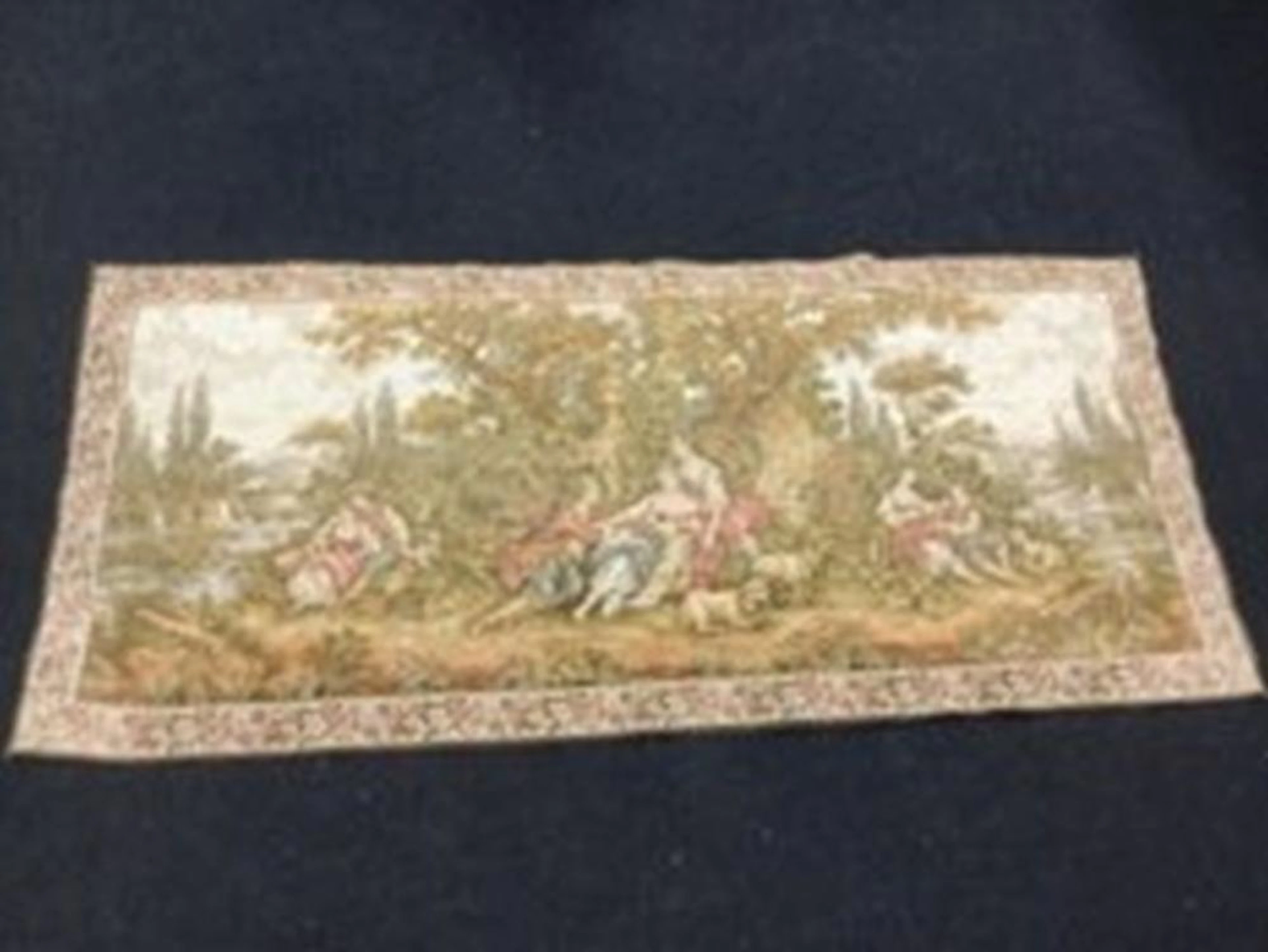 A 6ft Brussels style tapestry woven with amorous couples in pastoral landsc