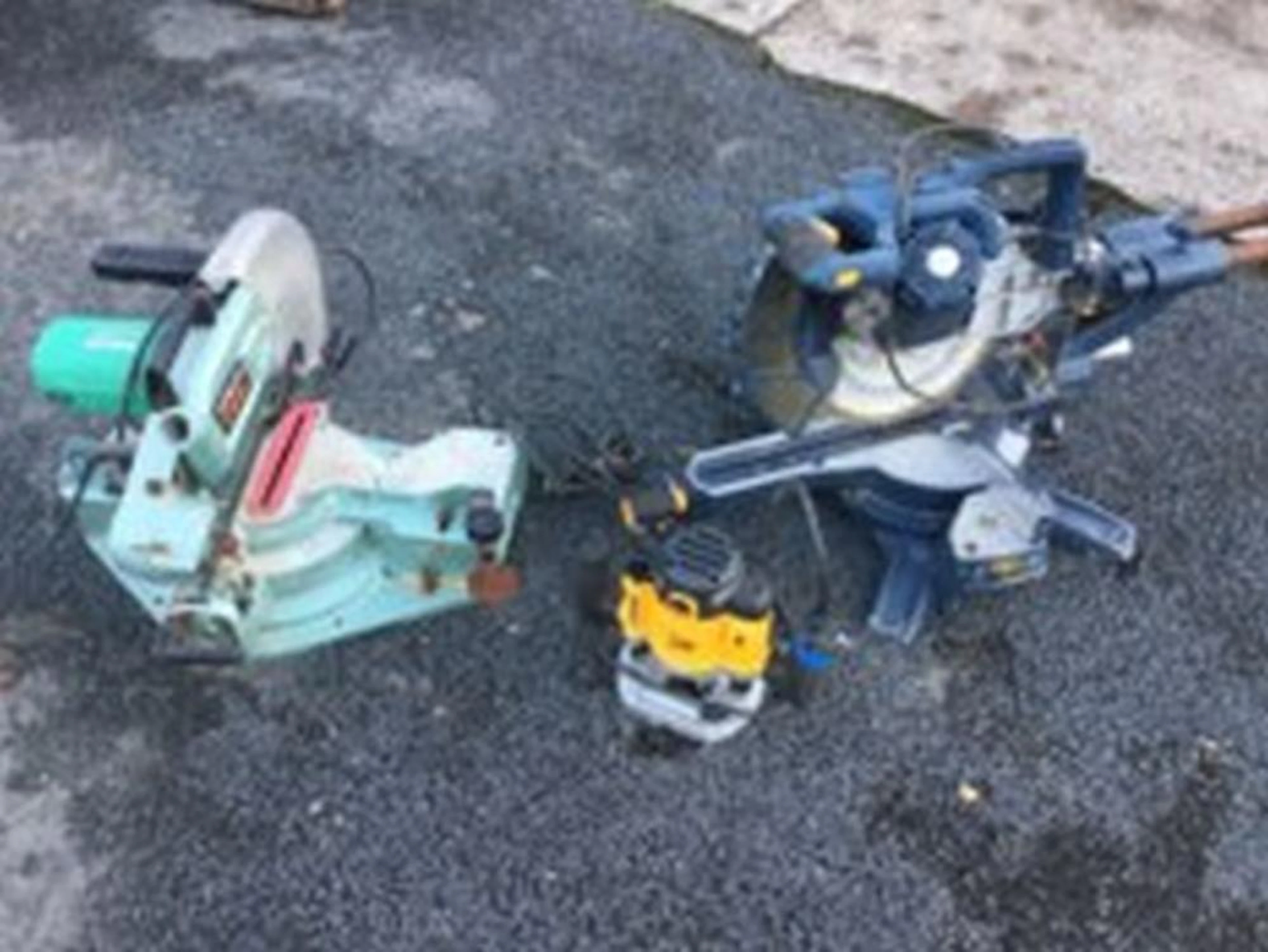 A Hitachi C10FCA electric table saw; a Macallister double bevel slice mitre