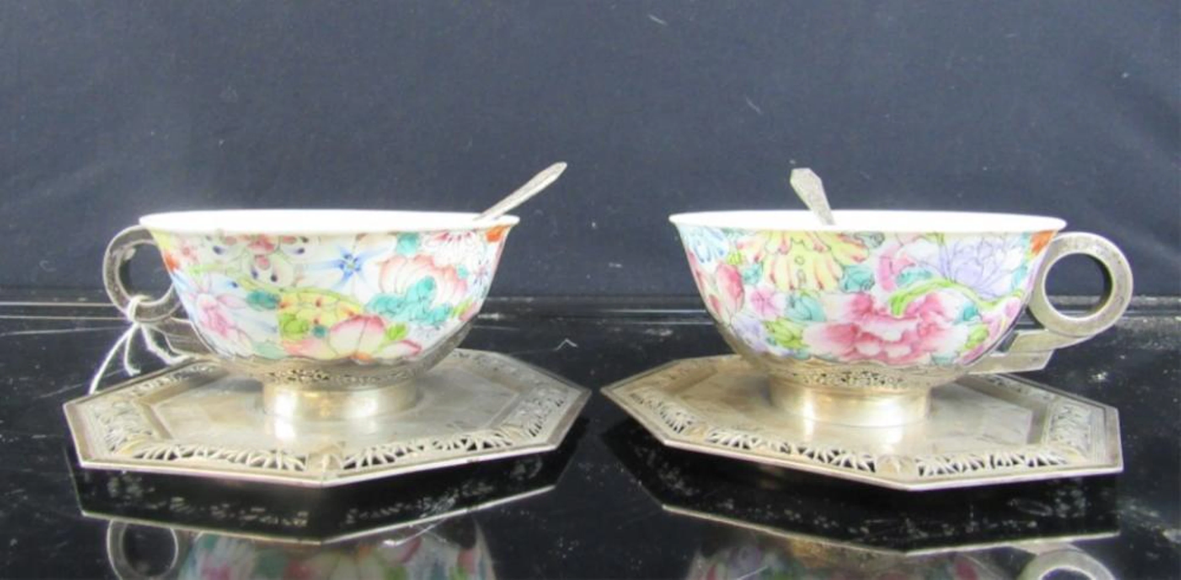 Set of Two Chinese Porcelain Teacups on Silver