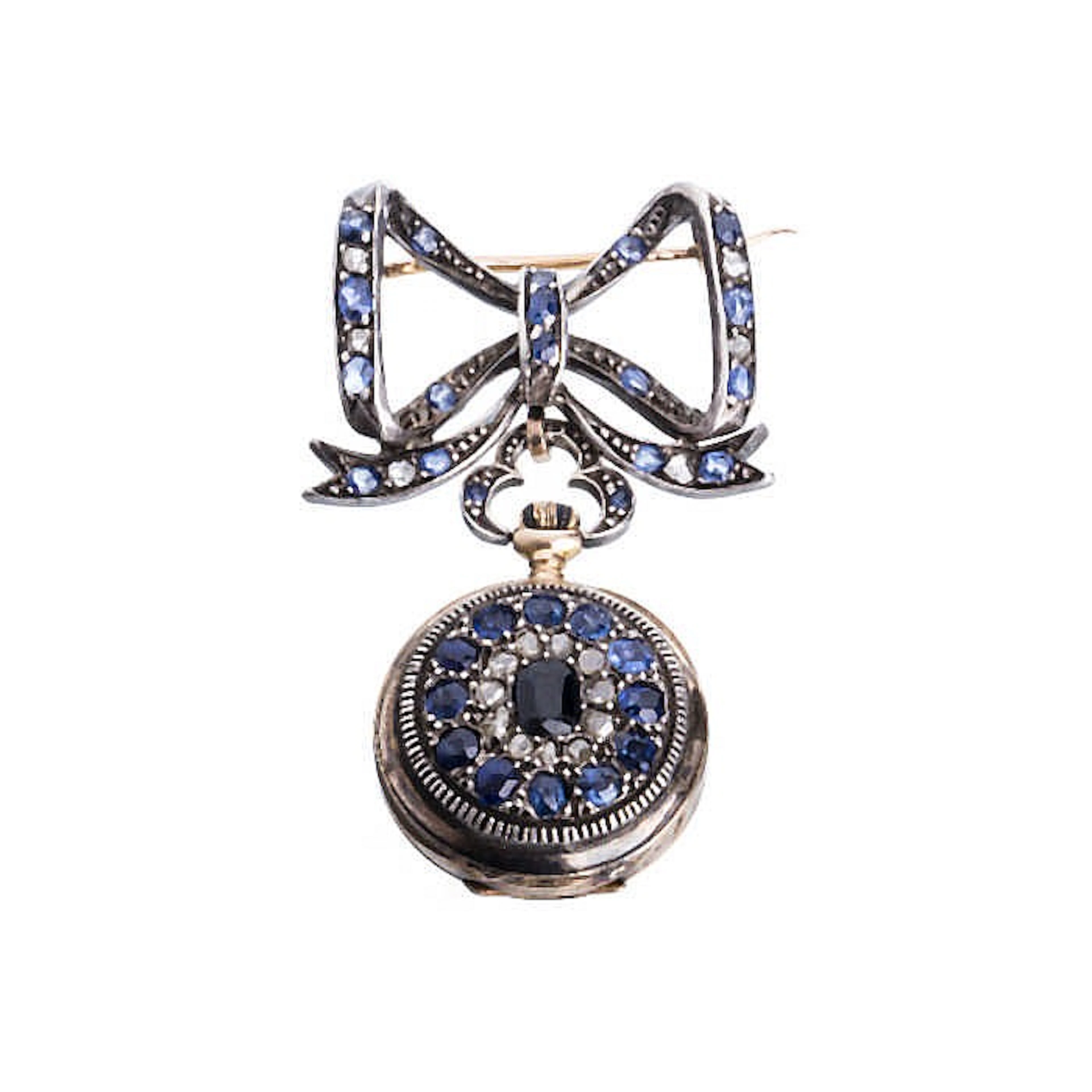 Bow pin gold and silver with diamonds and sapphires and a reverse watch