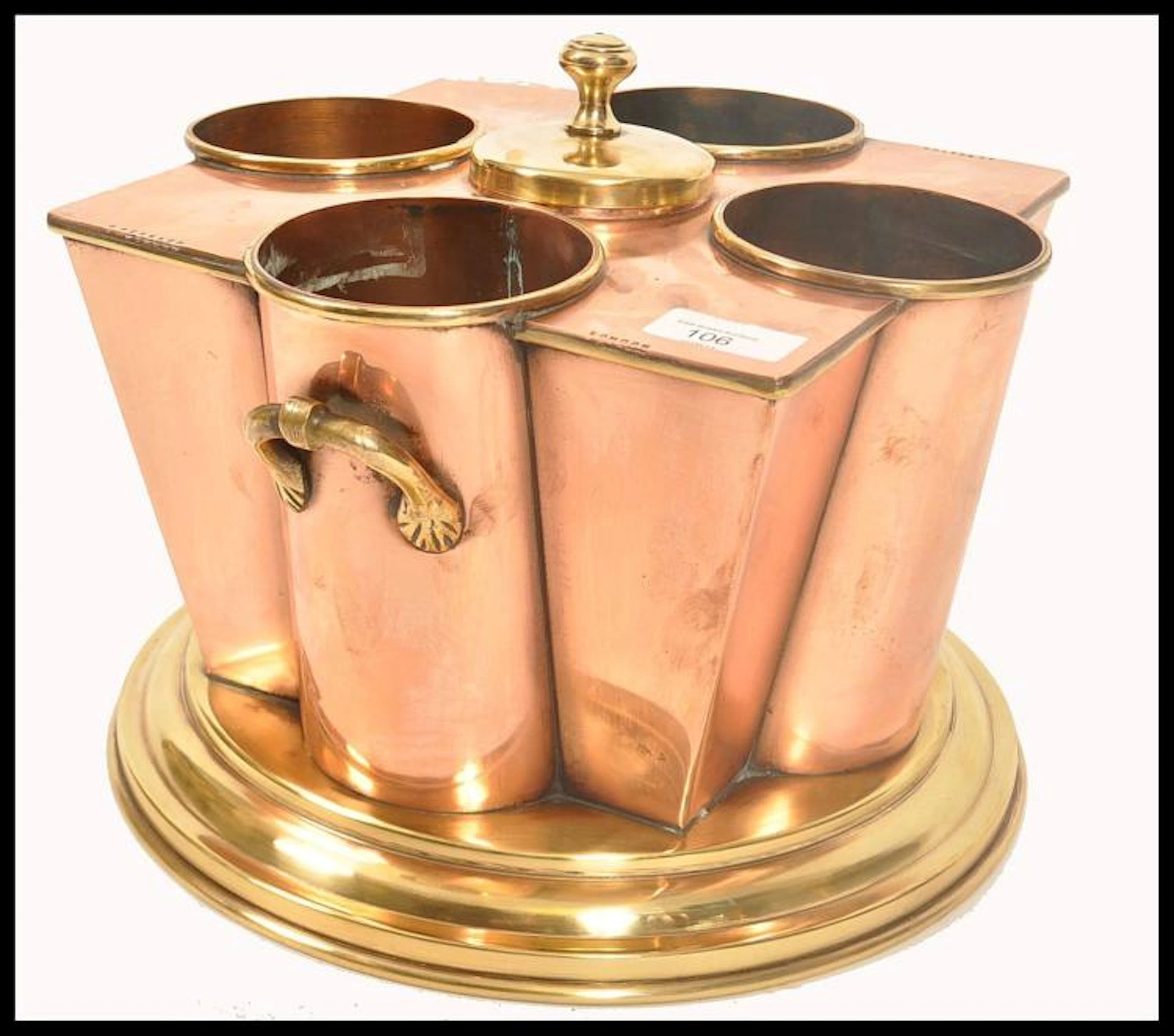 A stunning copper and brass wine cooler