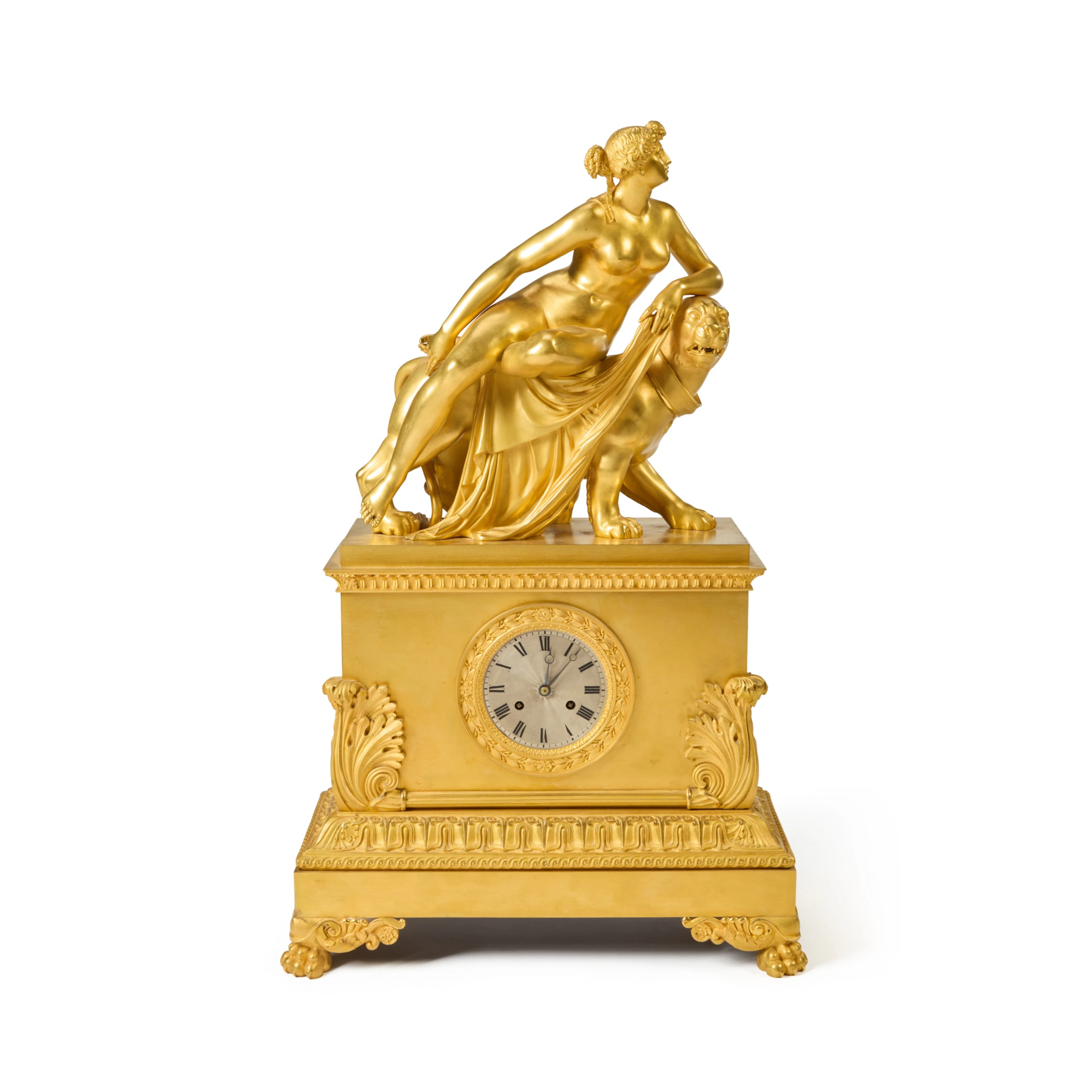 A large Empire gilt bronze sculptural mantel clock with...