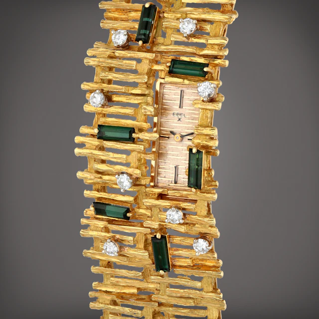 A yellow gold, diamond and tourmaline-set bracelet watch | Circa 1960s