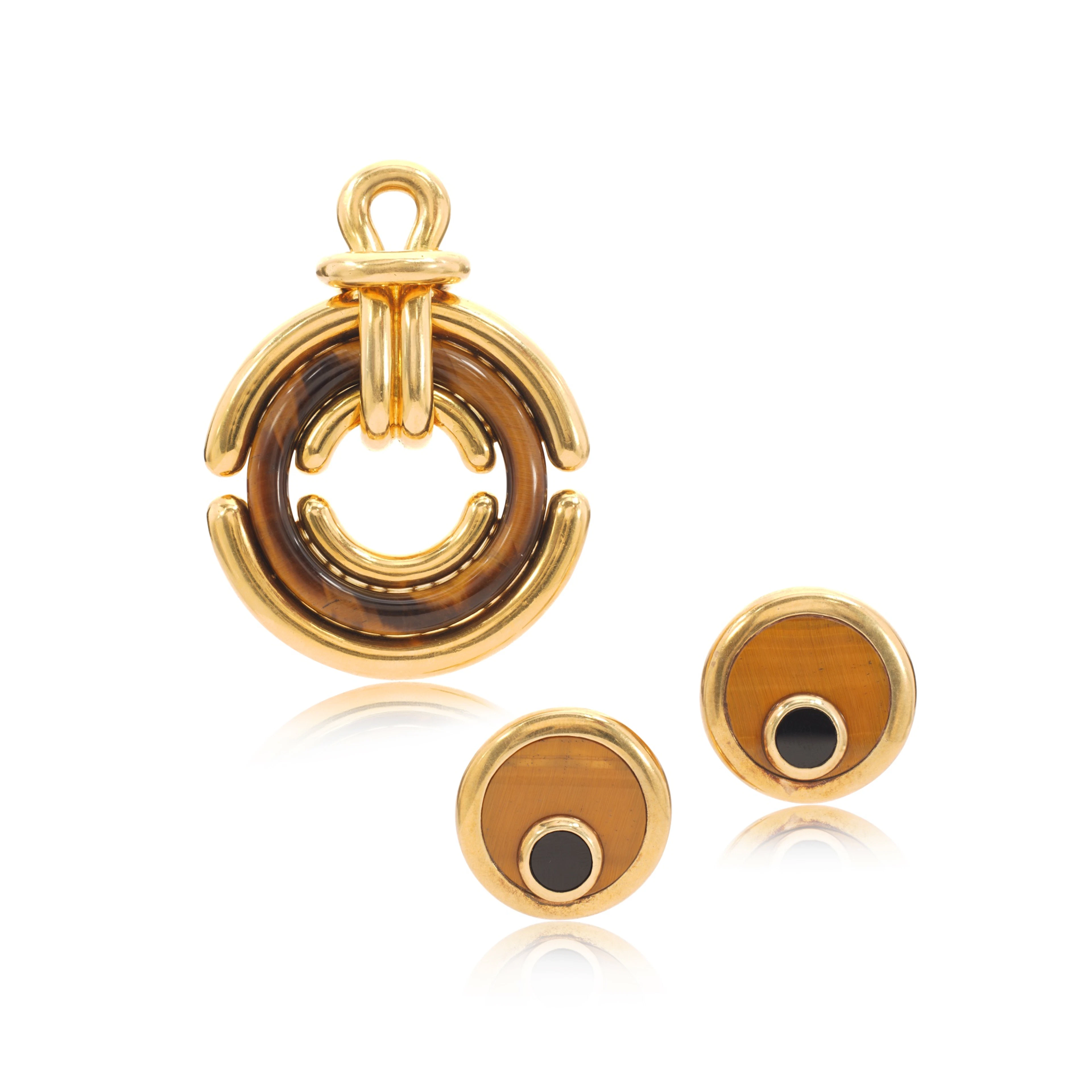Gold and tiger's eye pendant, circa 1972 and a pair of ear clips