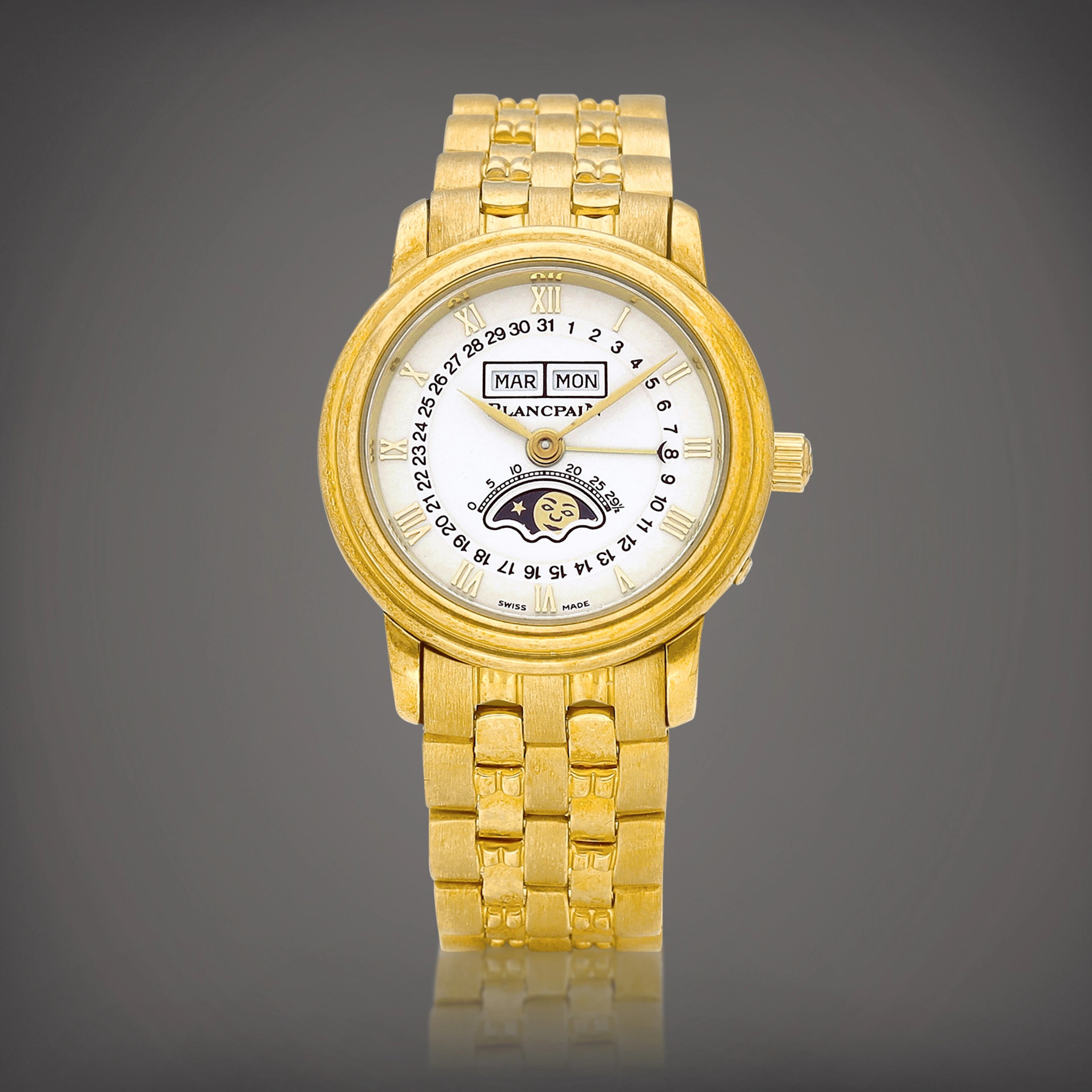 Villeret | A yellow gold triple calendar bracelet watch with moon phases