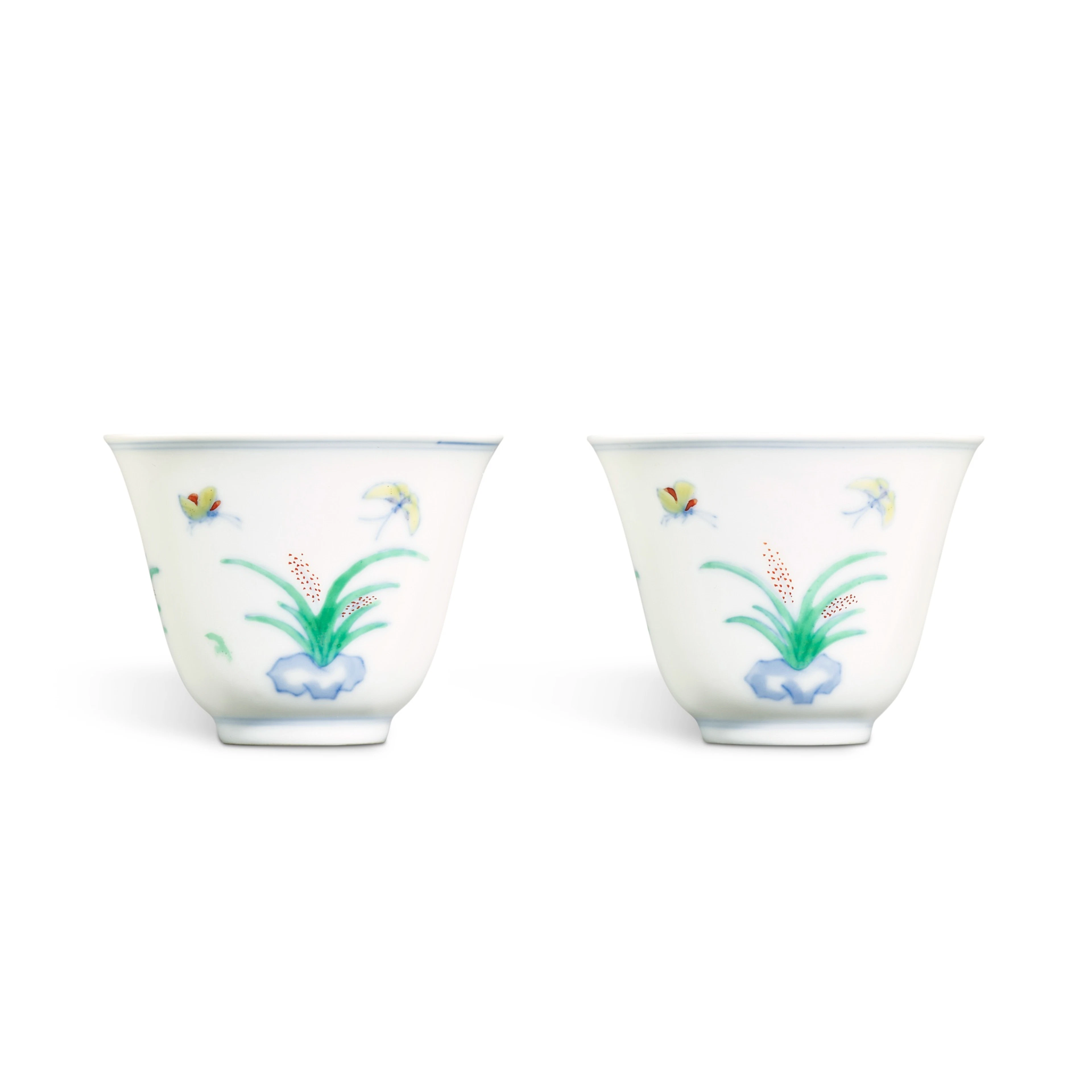 A pair of doucai 'butterfly and lily' wine cups