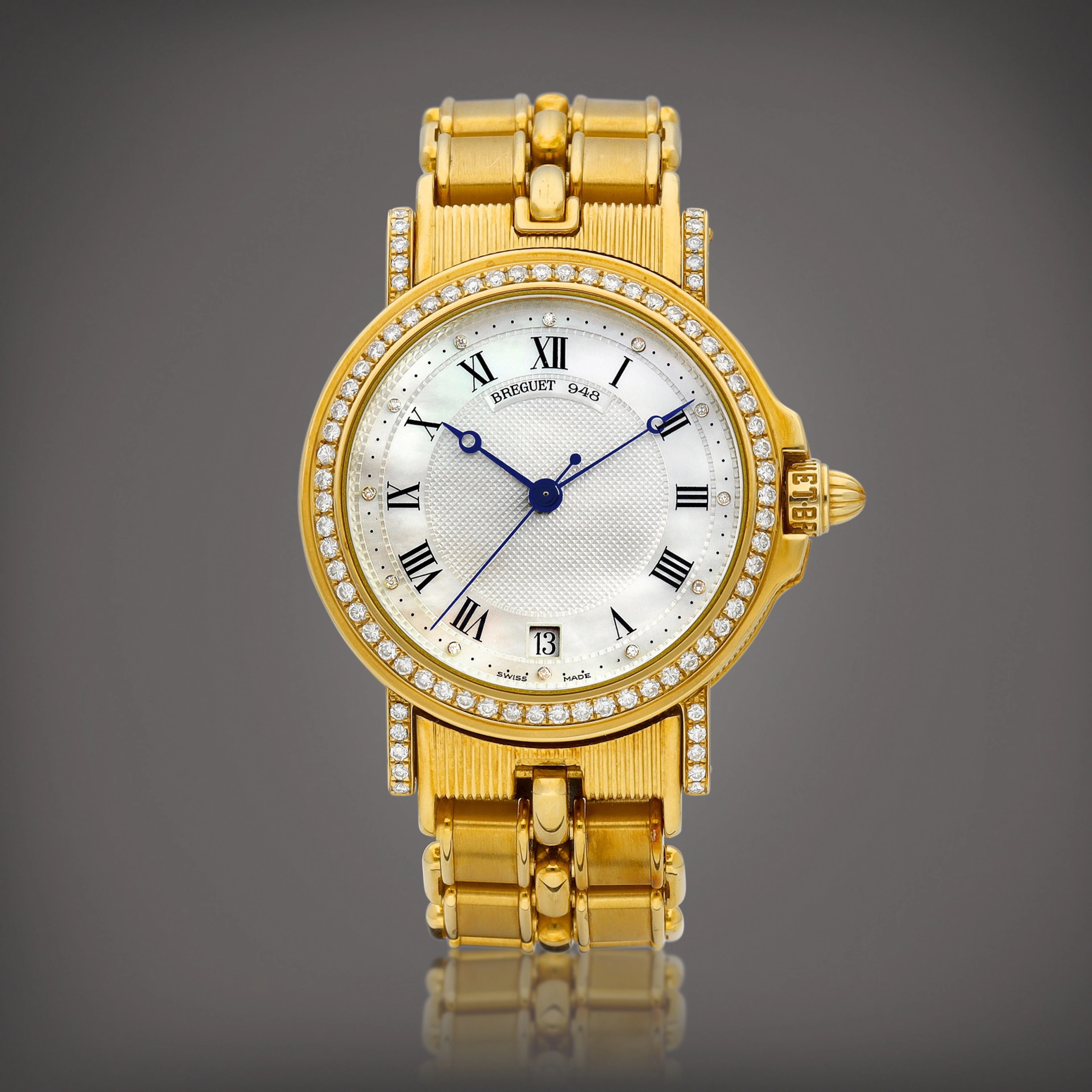 Horloger de la Marine | A yellow gold and diamond-set wristwatch with date