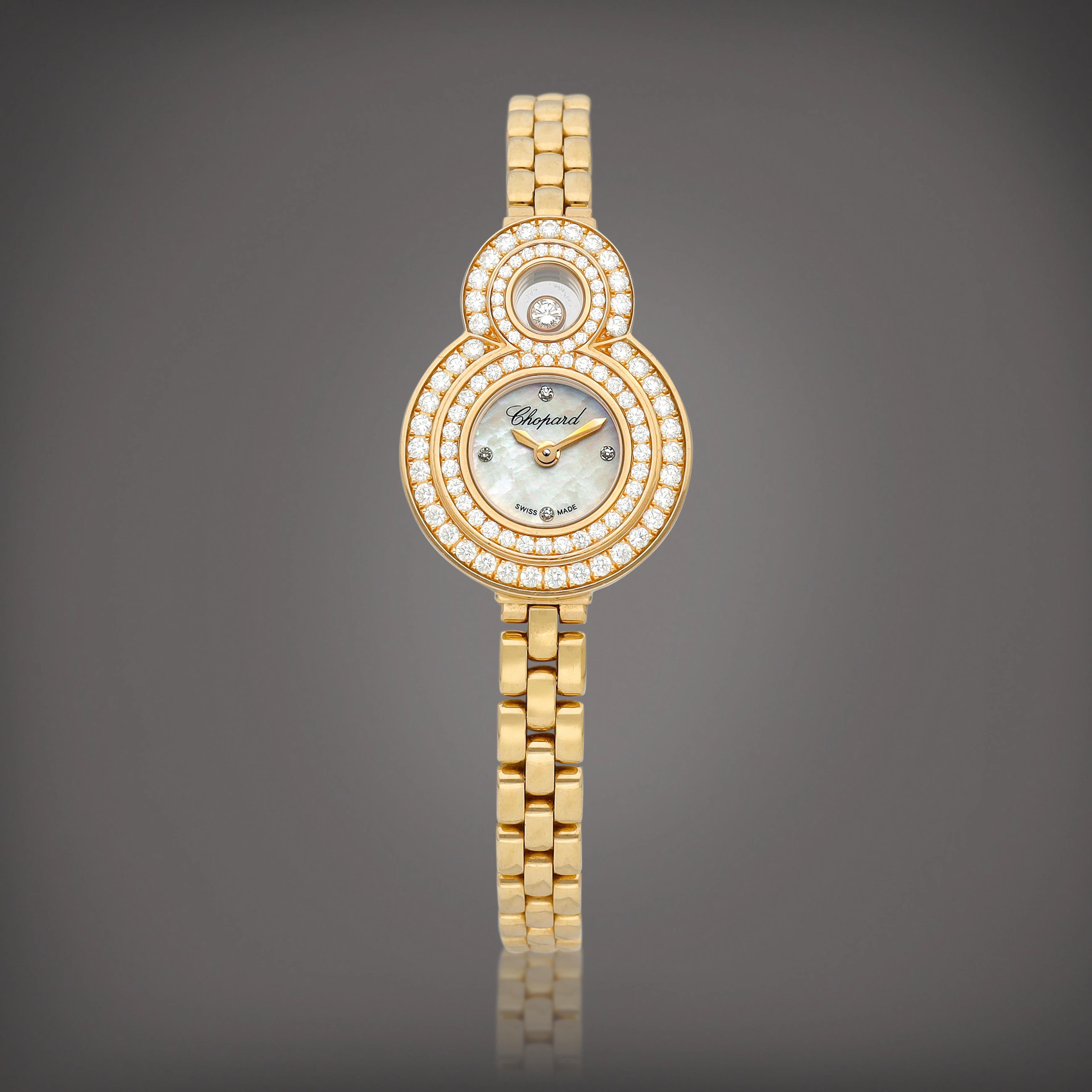 A pink gold and diamond-set bracelet watch with mother-of-pearl dial