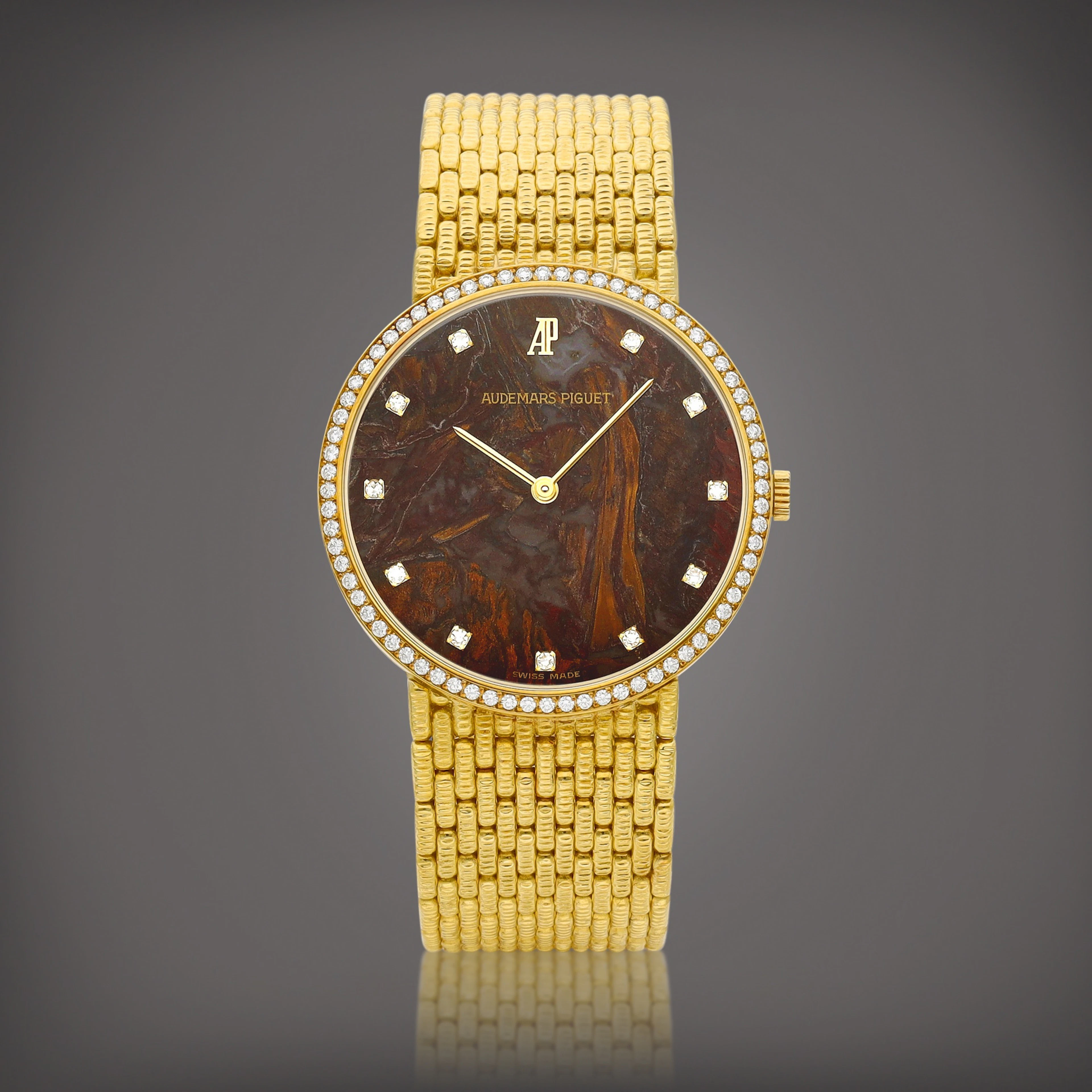 A yellow gold and diamond-set bracelet watch with hardstone dial